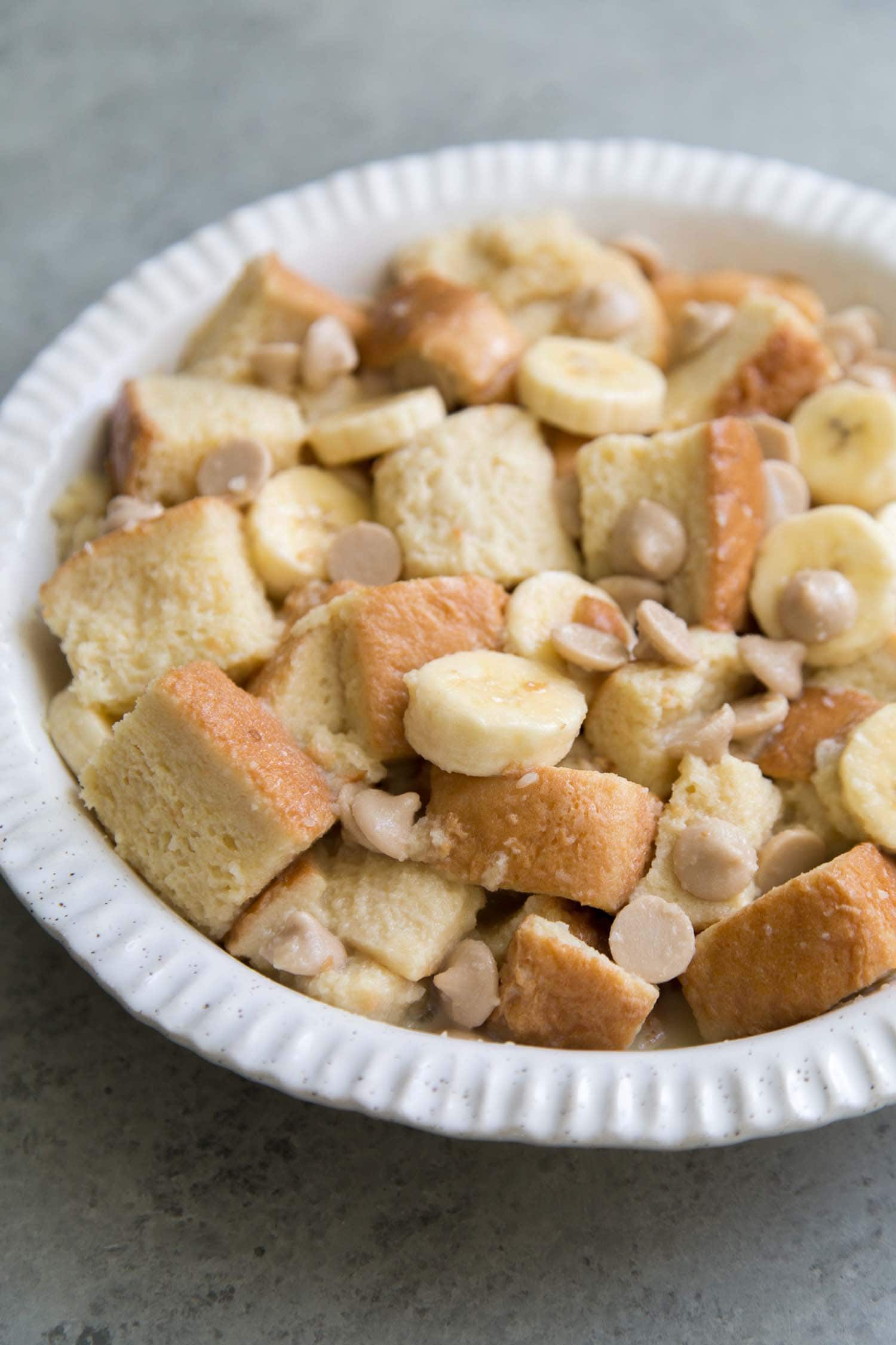 Banana Rum Bread Pudding assembled in pie plate before baking.