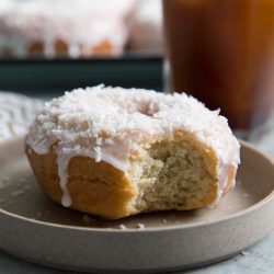 Coconut Cake Doughnut served on a small plate.