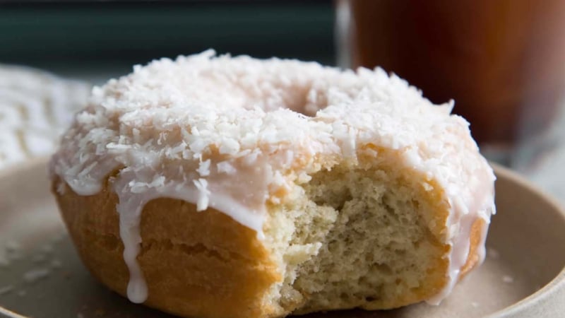 Coconut Cake Doughnut served on a small plate.
