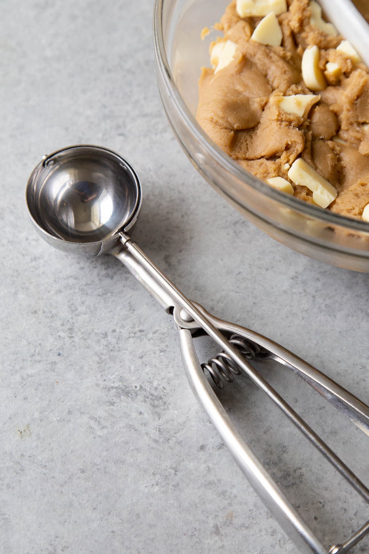 use a cookie scoop to portion cookie dough.