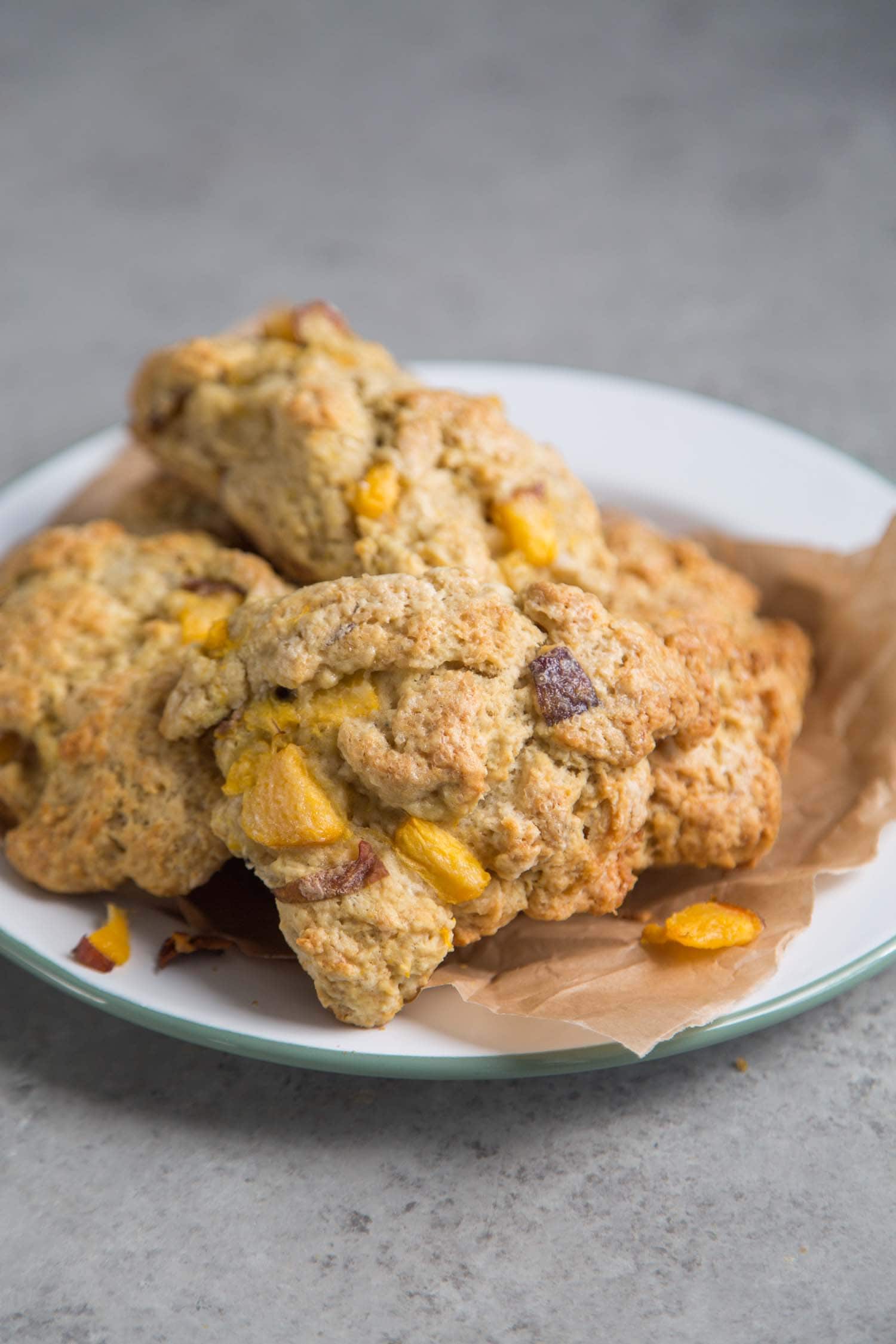 nectarine scones piled together in serving plate. 