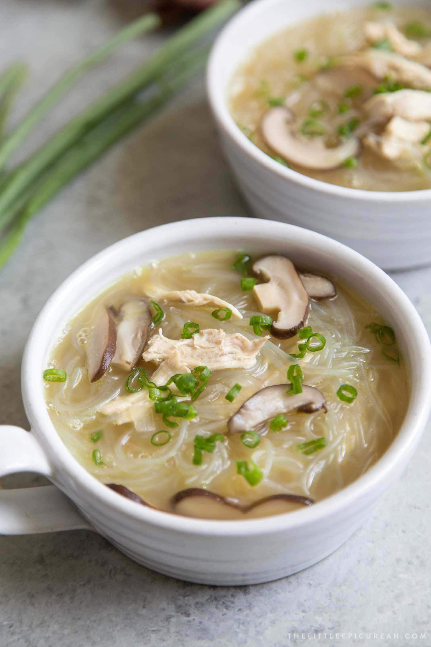 Chicken Sotanghon Soup garnished with green onions. 