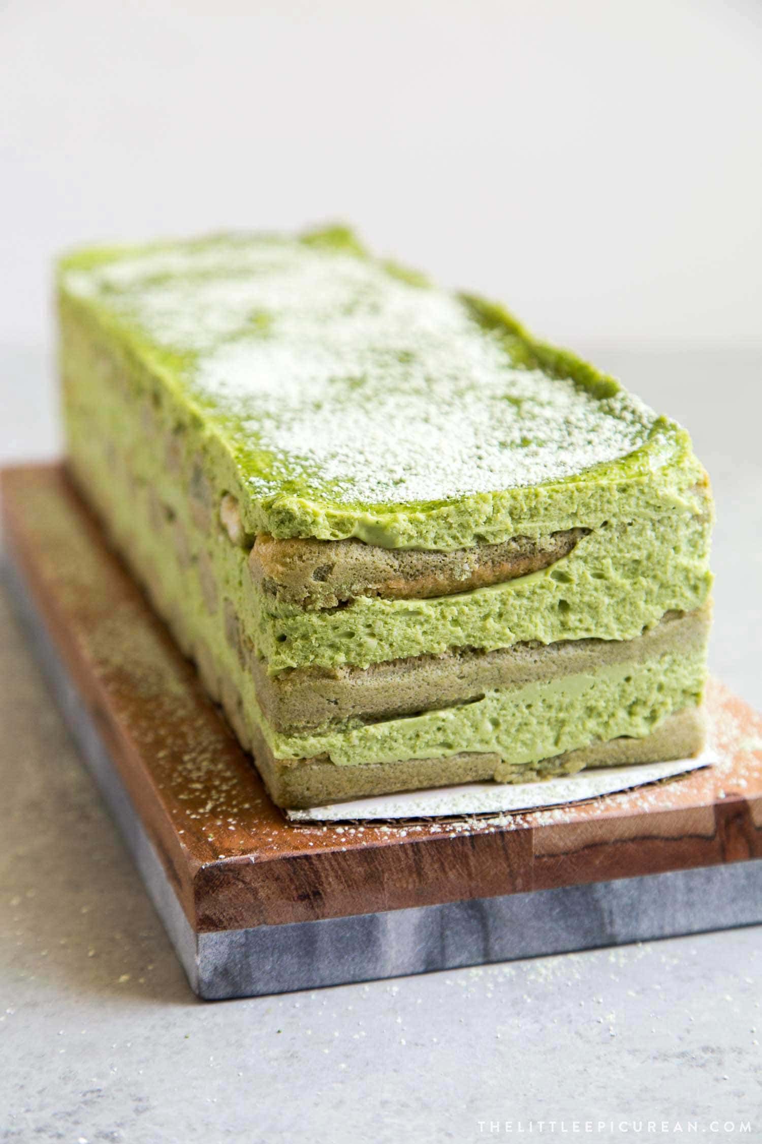 Matcha Tiramisu on wooden serving board.