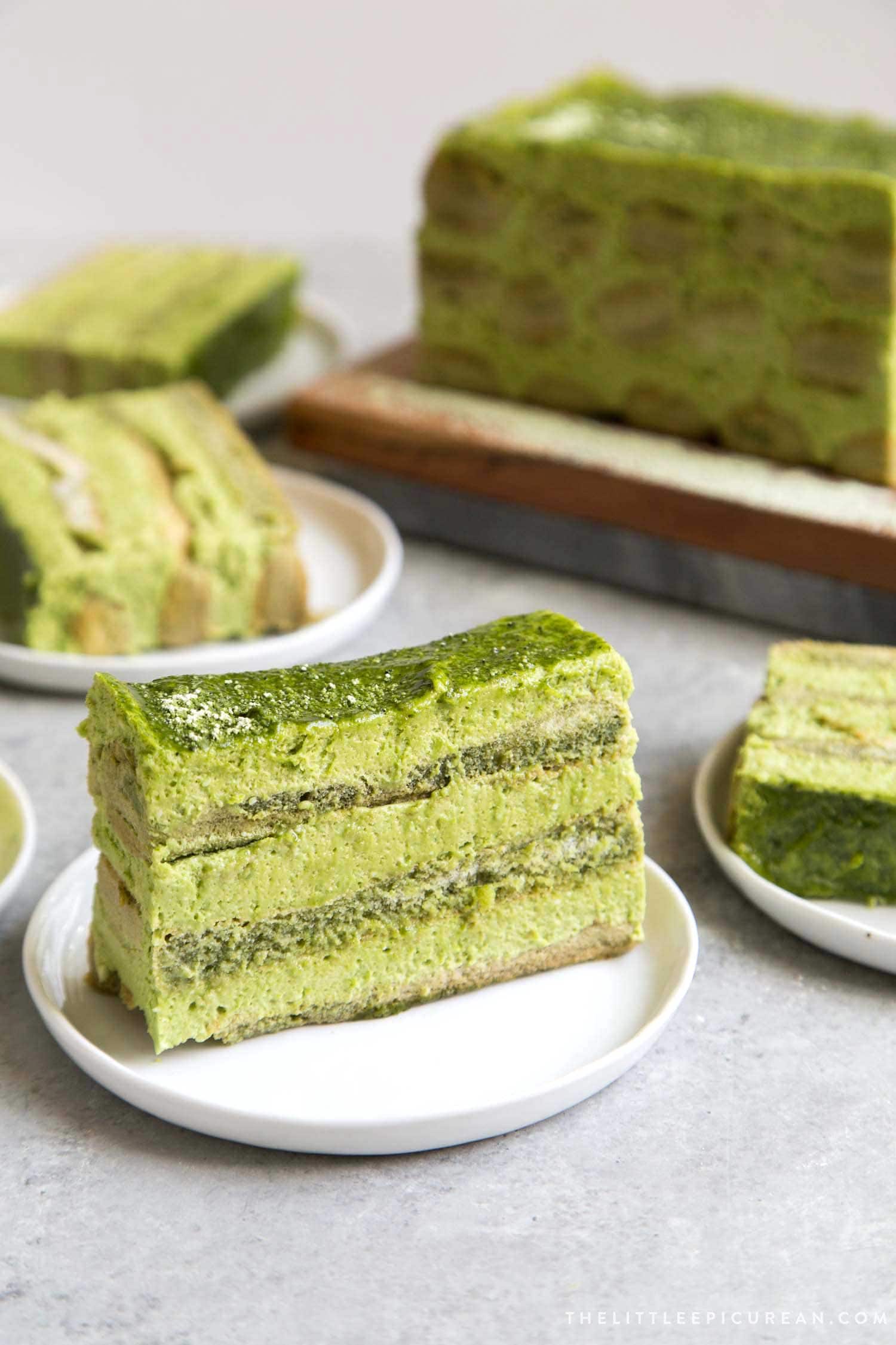 Matcha Tiramisu slice on white serving plate. 