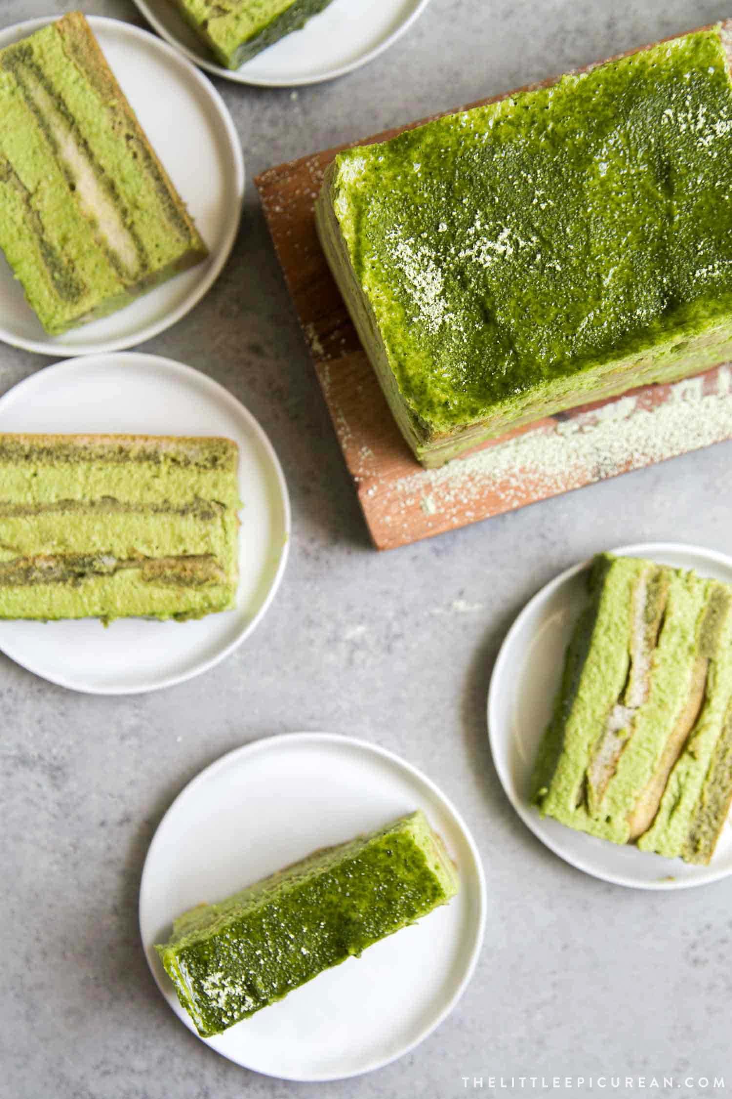 Matcha Tiramisu slices on white plates. 