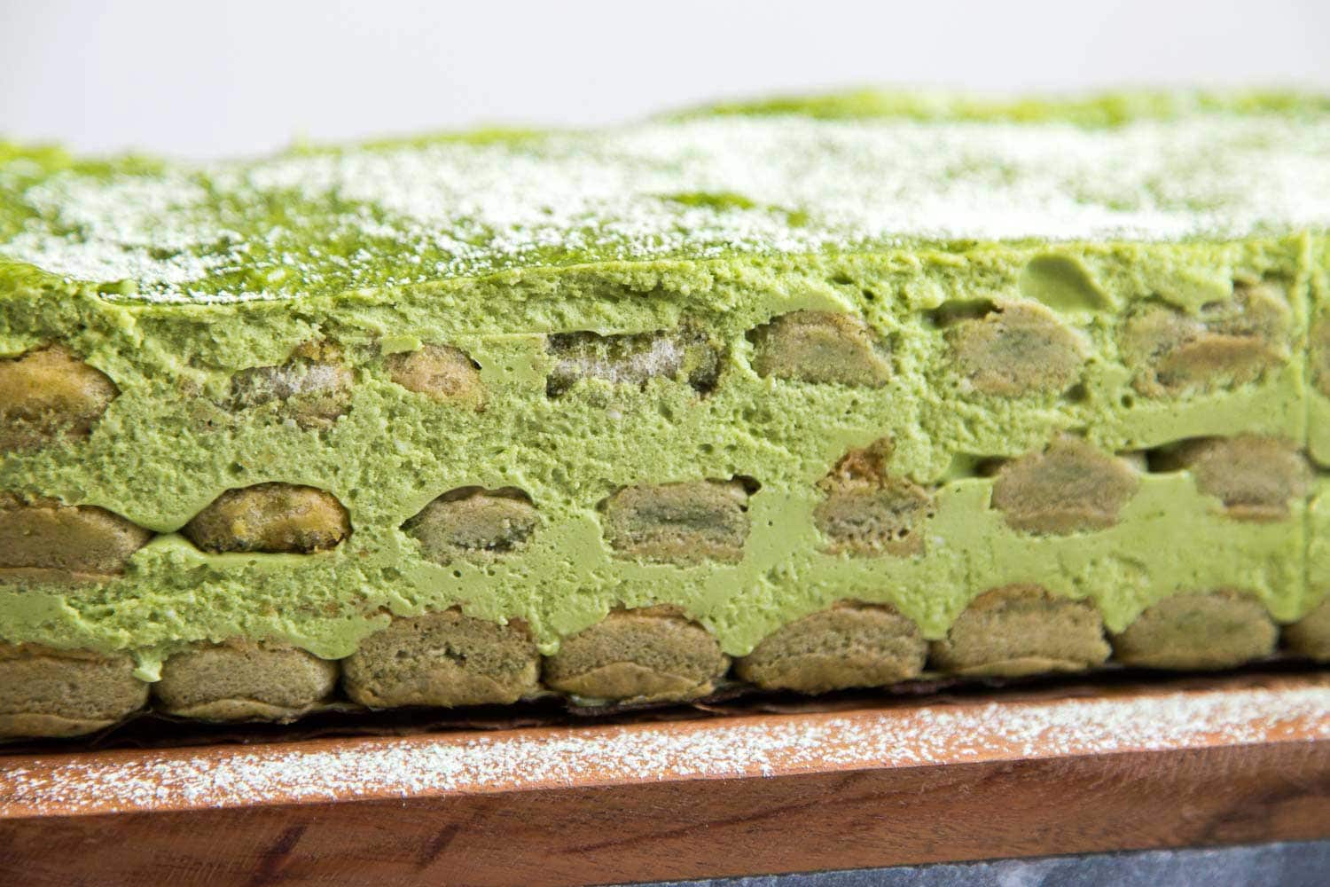 Matcha Tiramisu cake from the side angle. 