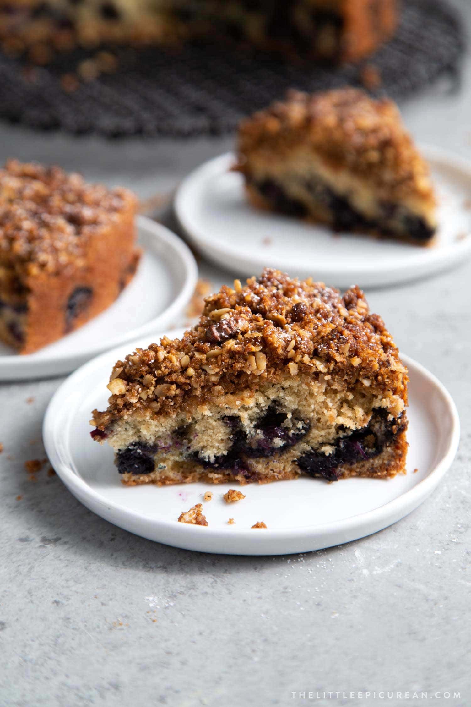 slice of Blueberry Walnut Streusel Cake made with fresh blueberries topped with oat-walnut mixture