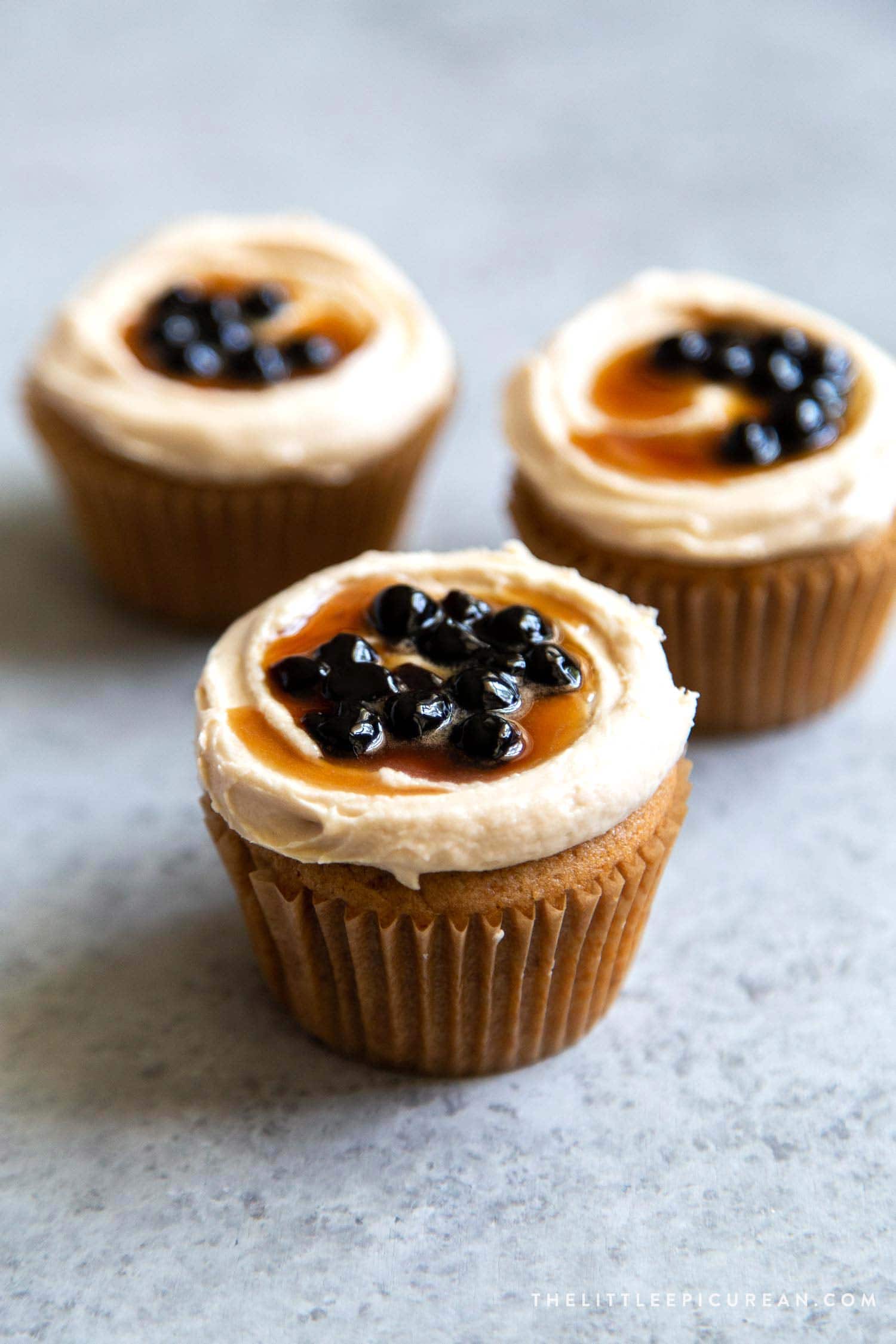 Boba Tea Cupcakes. Milk tea cupcakes filled with brown sugar boba and frosted with milk tea buttercream.