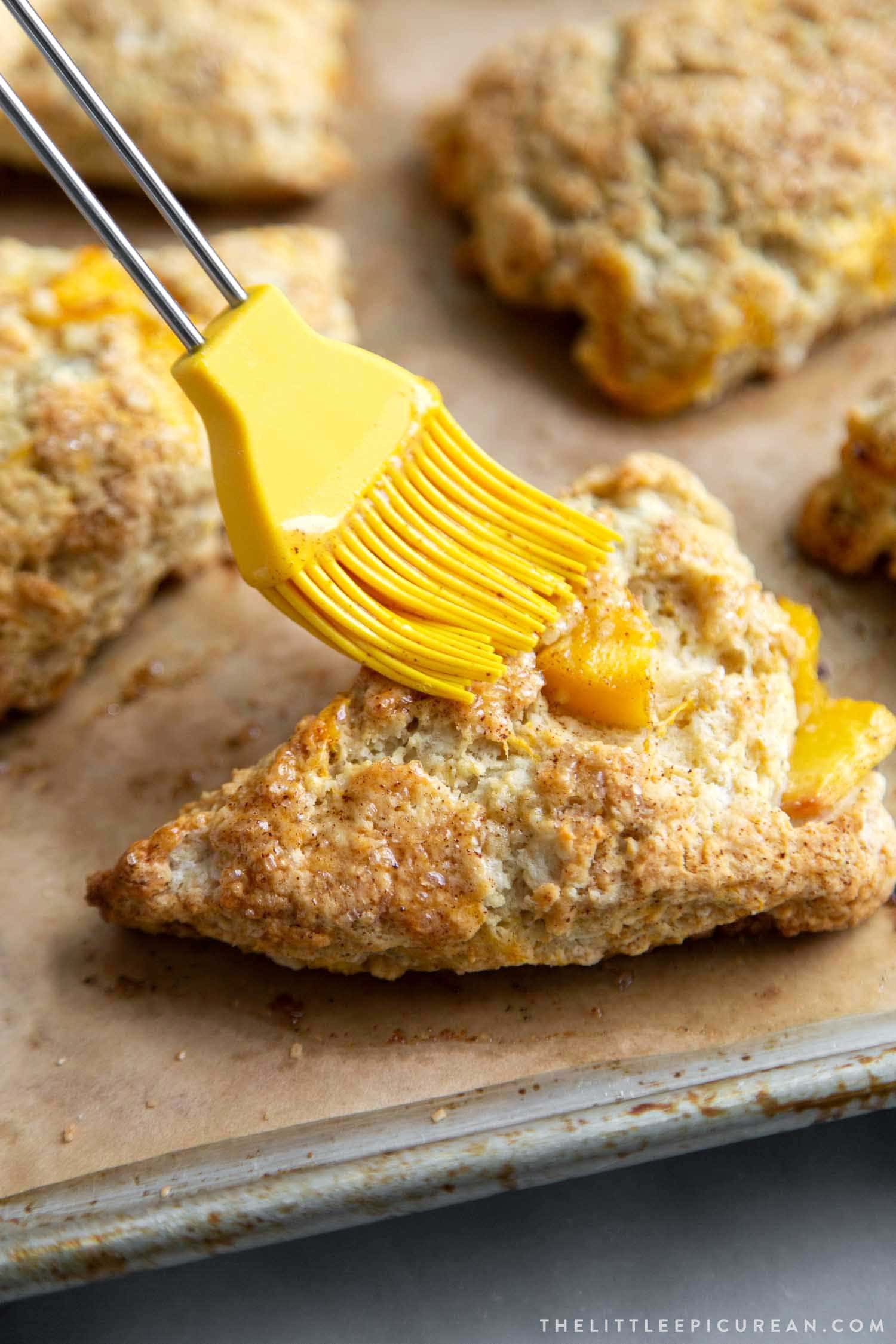 Brown Butter Peach Scones get another brushing of melted brown butter after baking. 