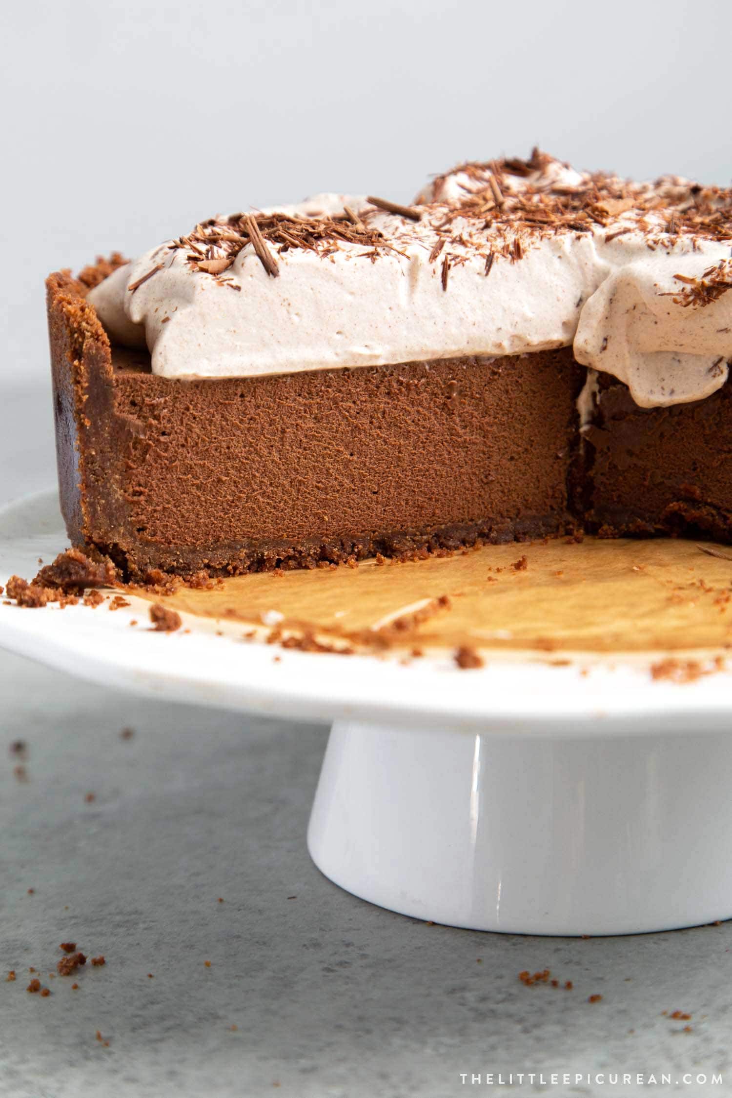 Chocolate Mousse Pie. Chocolate graham cracker crust filled with chocolate mousse and topped with whipped cream and chocolate shavings.