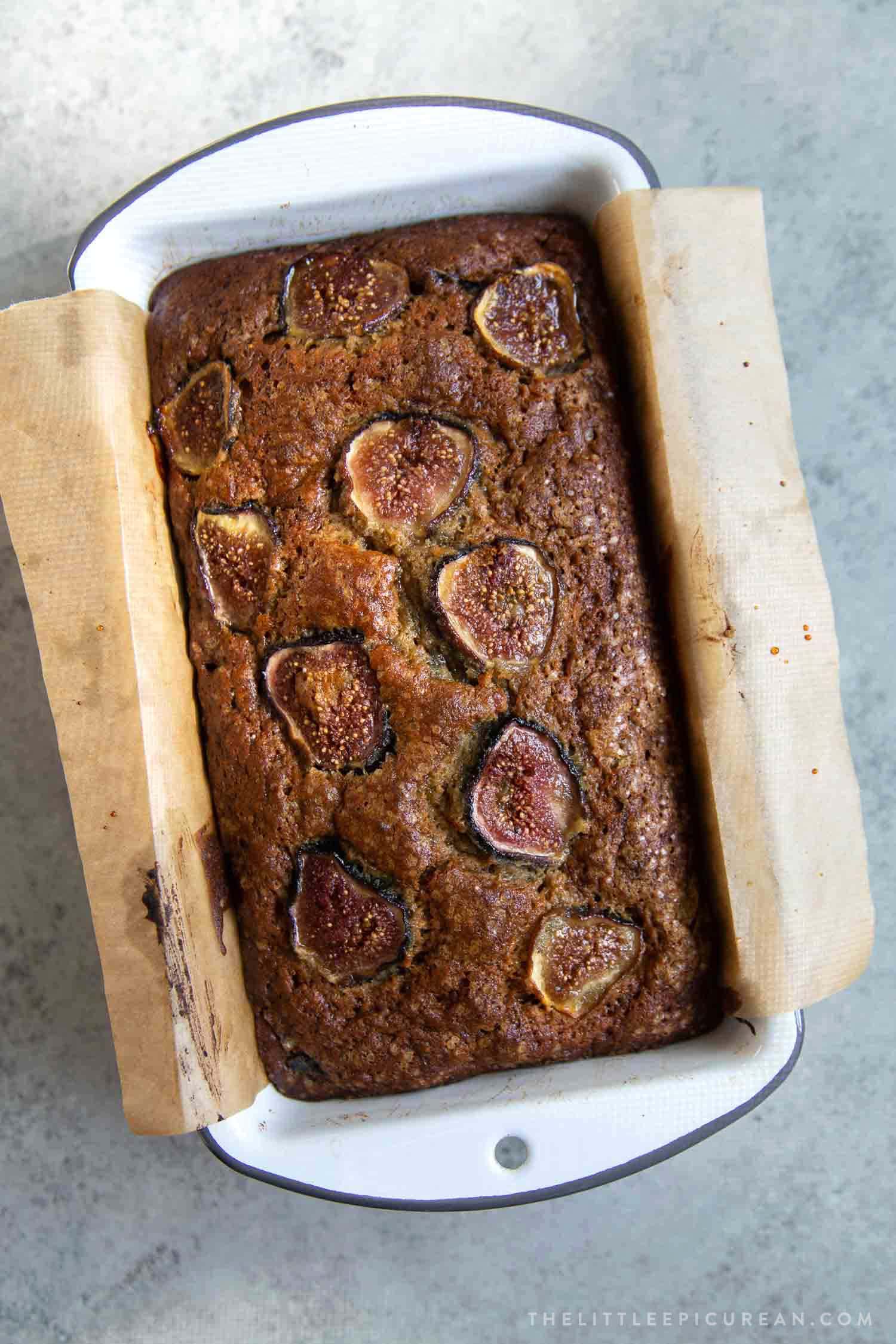 Fig Banana Bread. Brown sugar banana bread mixed with chopped figs in the batter and sliced figs on top to garnish. 