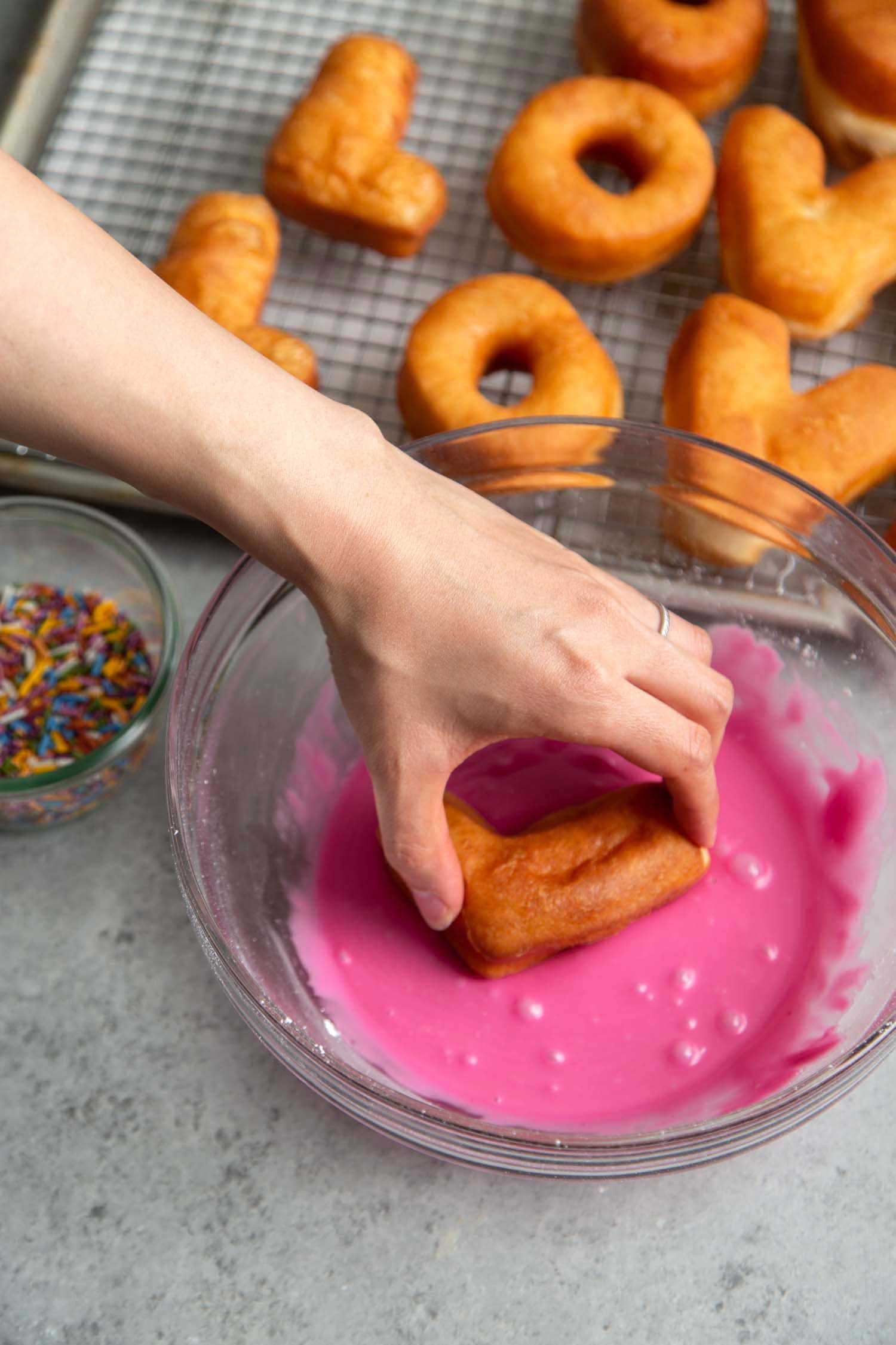 Yeast donuts dipped in pink glaze naturally colored with beet powder