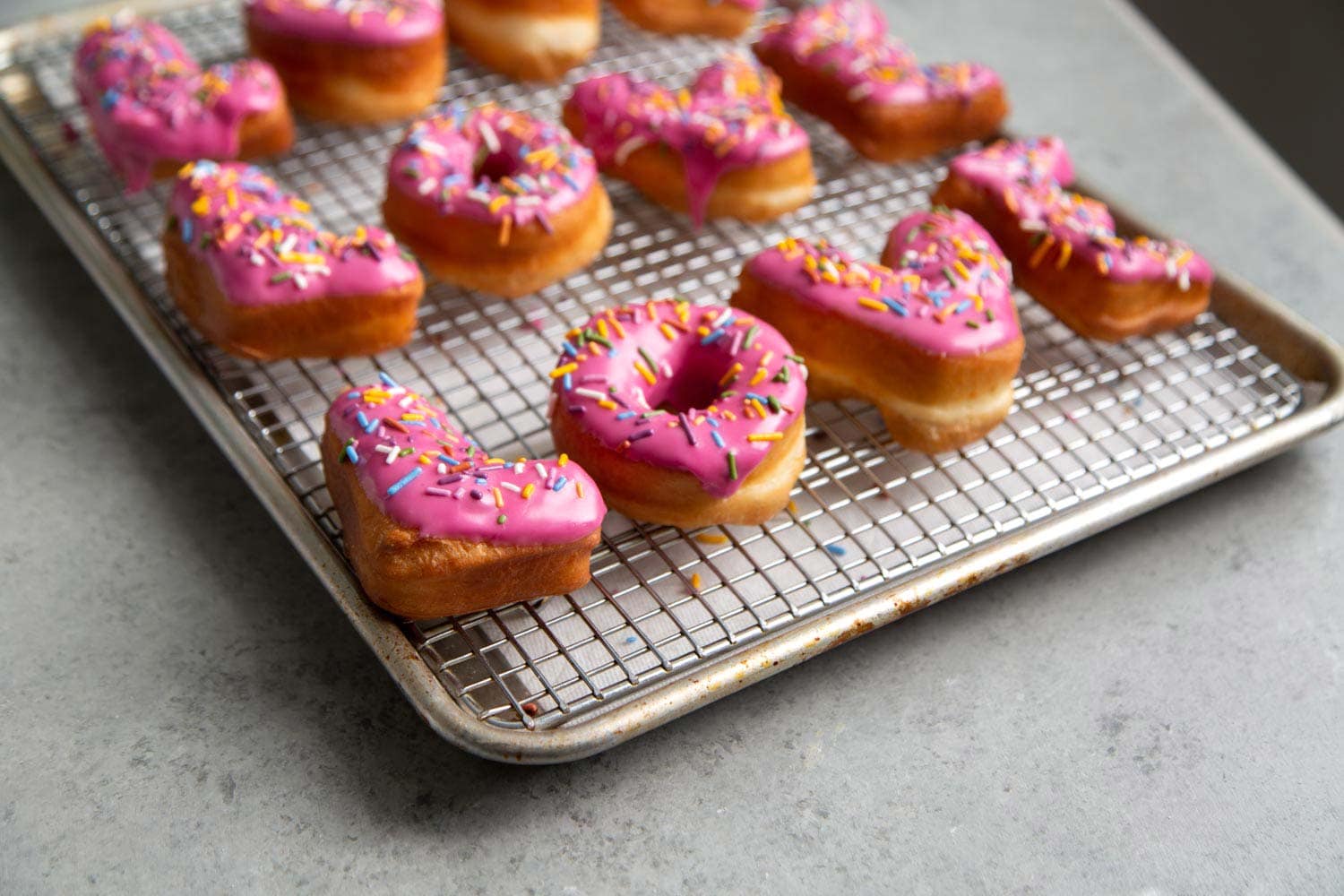 Yeast donuts dipped in pink glaze naturally colored with beet powder
