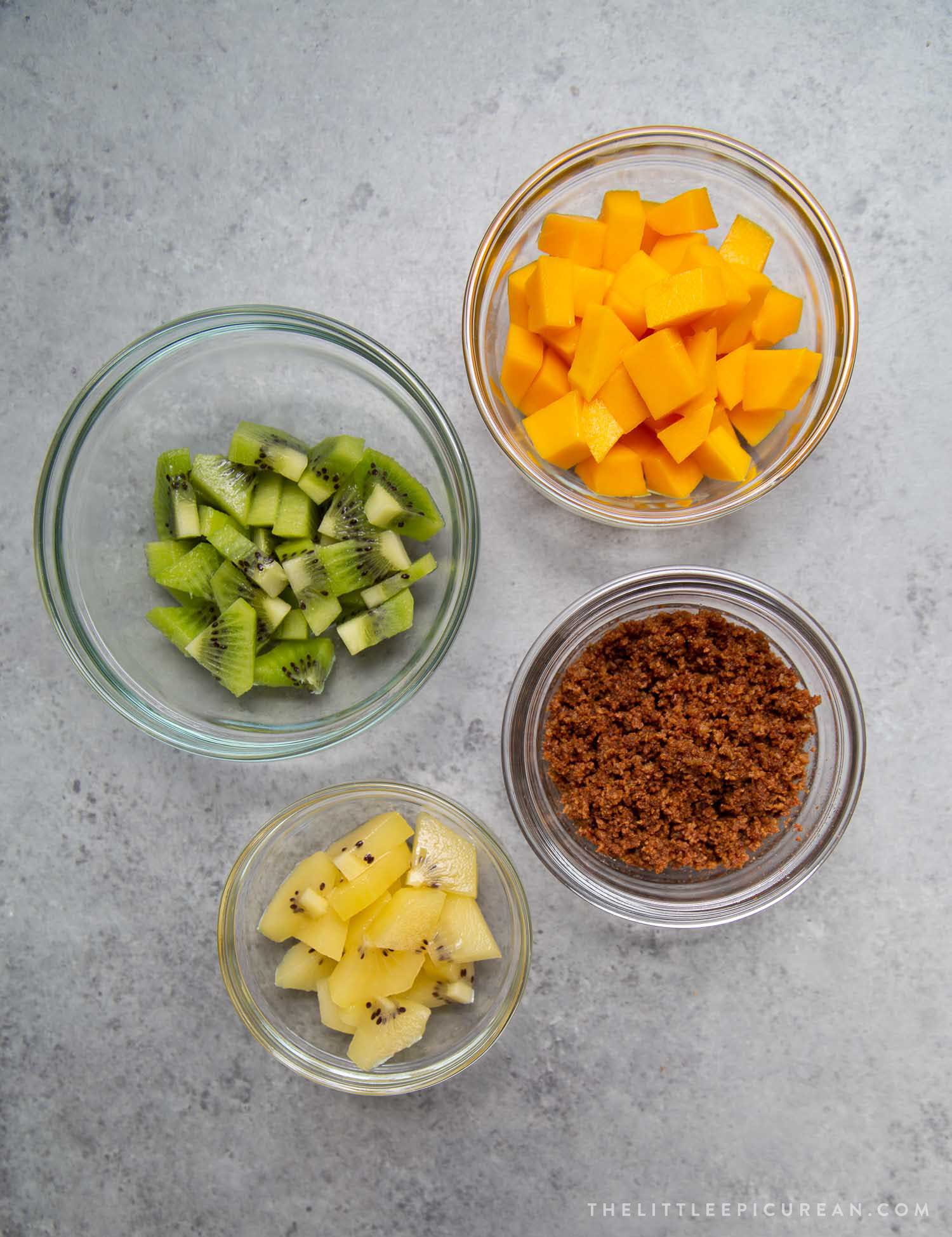 Coconut Panna Cotta toppings: green kiwi, golden kiwi, mango, and latik