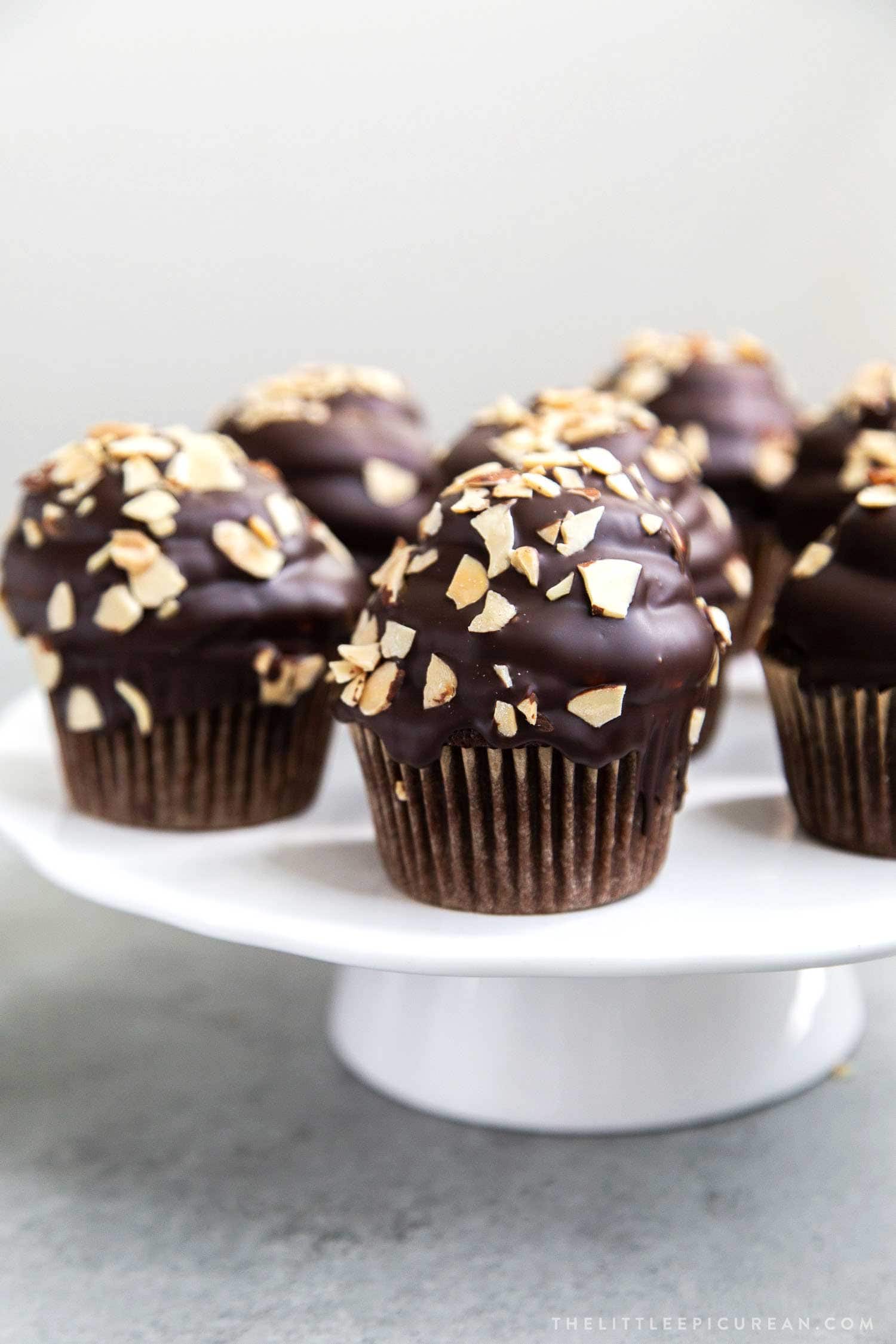 Almond Mocha Hi-Hat Cupcakes. Easy to make chocolate cupcakes topped with espresso meringue. It's dipped in chocolate and topped with toasted almonds.