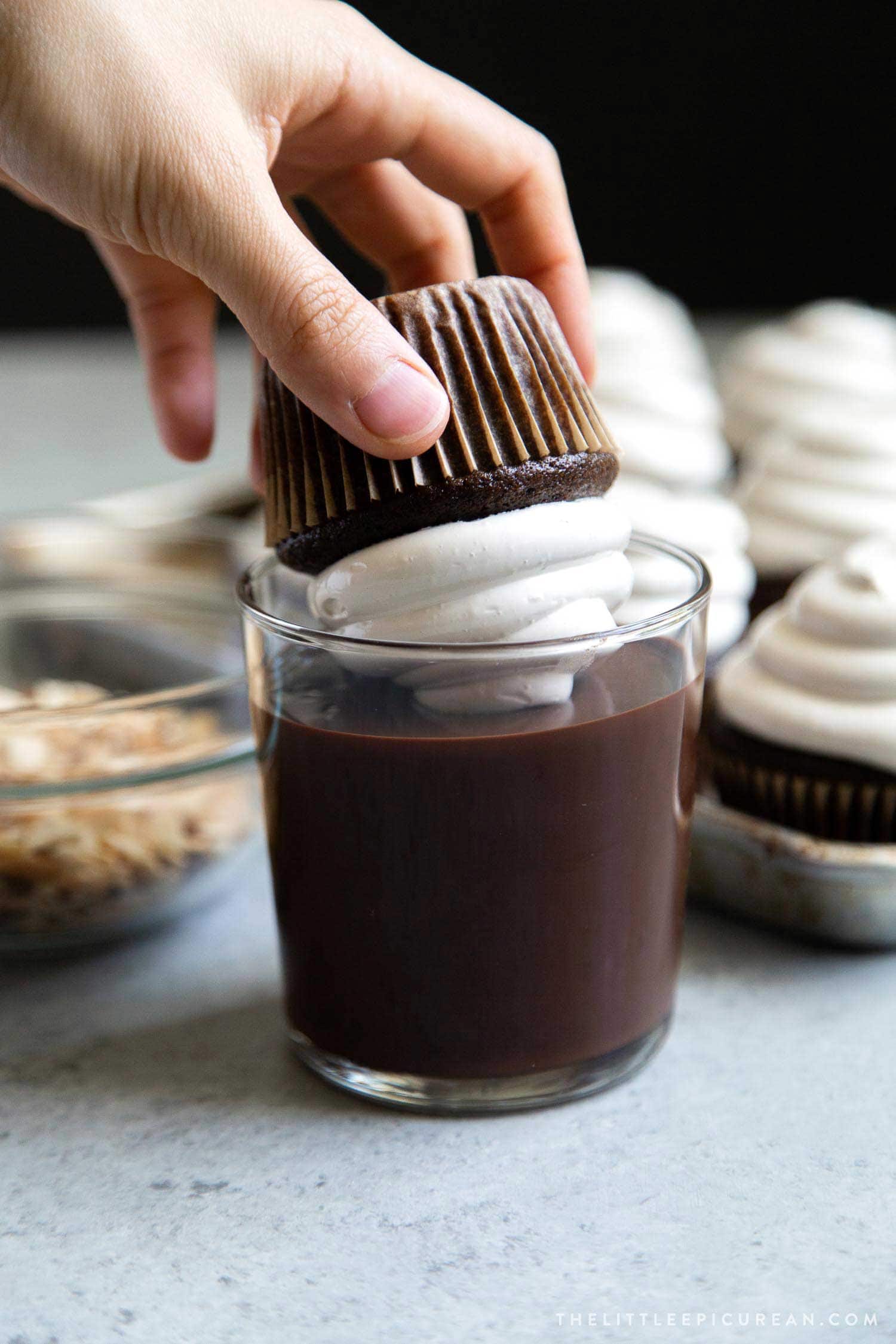 Almond Mocha Hi-Hat Cupcakes. Espresso meringue topped chocolate cupcakes dipped in melted chocolate.