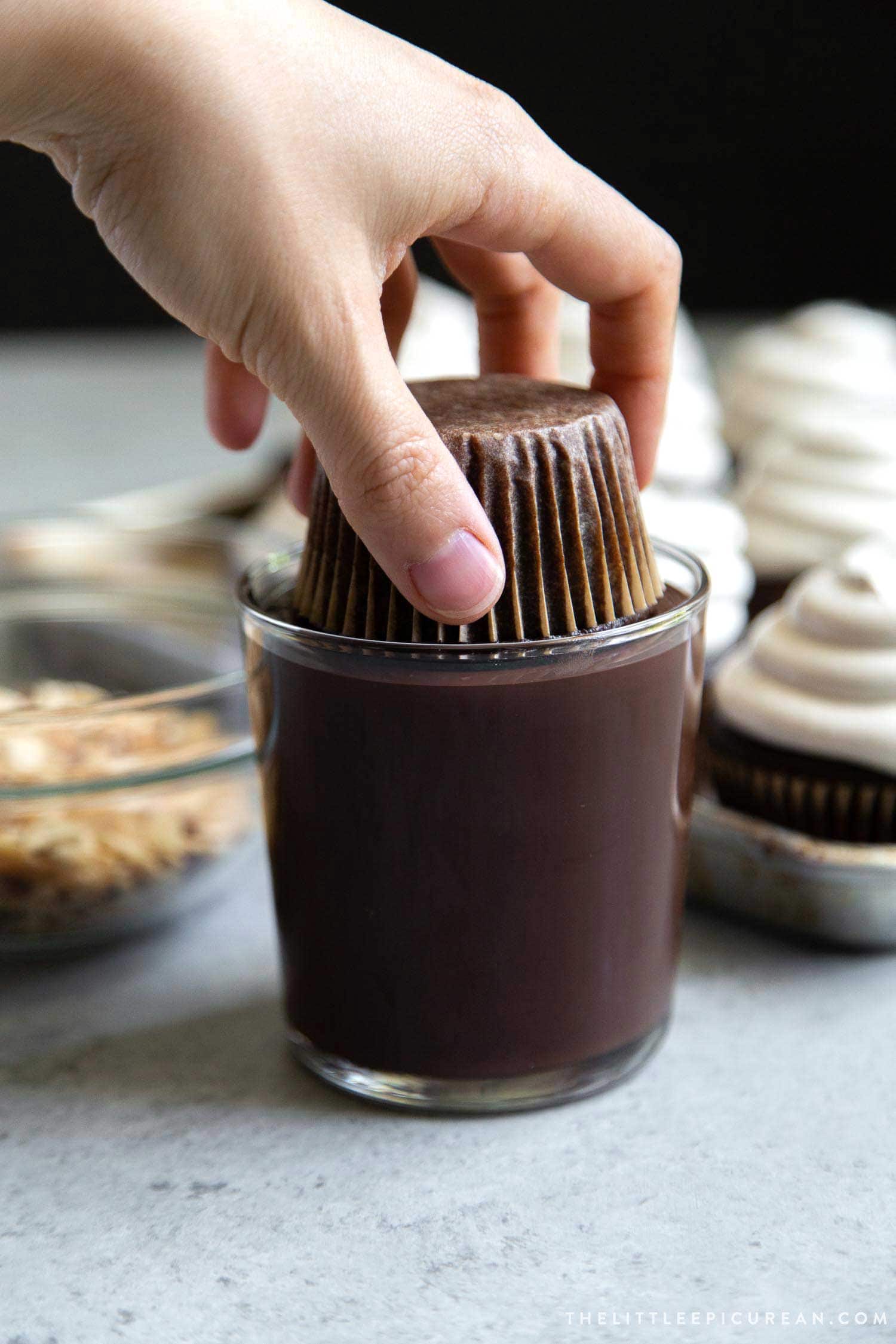 Almond Mocha Hi-Hat Cupcakes. Espresso meringue topped chocolate cupcakes dipped in melted chocolate.