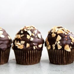 Almond Mocha Hi-Hat Cupcakes. Easy to make chocolate cupcakes topped with espresso meringue. It's dipped in chocolate and topped with toasted almonds.