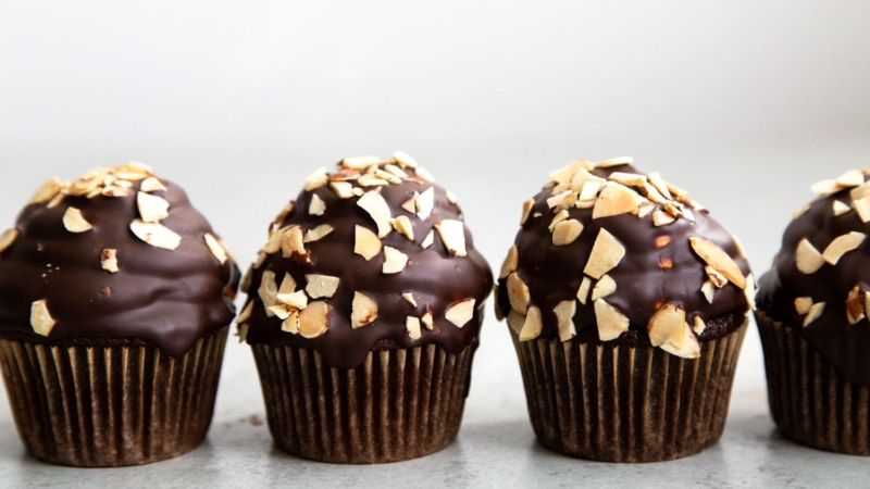 Almond Mocha Hi-Hat Cupcakes. Easy to make chocolate cupcakes topped with espresso meringue. It's dipped in chocolate and topped with toasted almonds.