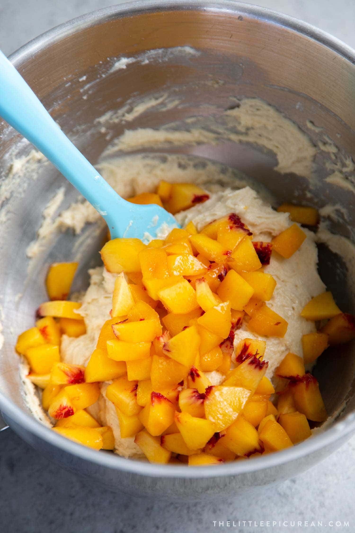 Almond Streusel Peach Muffin batter made using fresh chopped peaches.