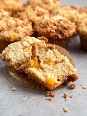 Almond Streusel Peach Muffins. Vanilla muffins mixed with fresh peaches and topped to almond streusel crumble.