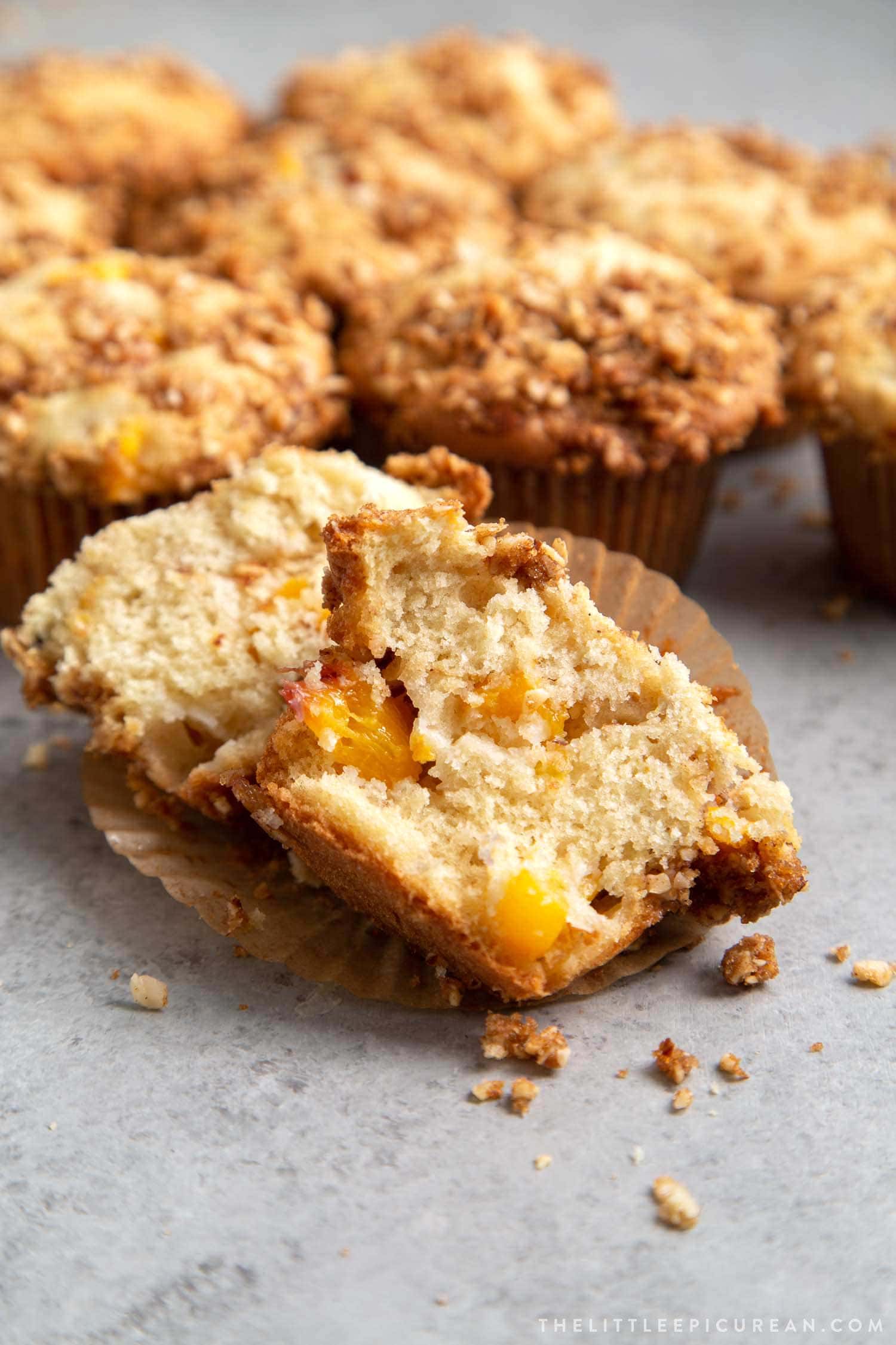 Almond Streusel Peach Muffins. Vanilla muffins mixed with fresh peaches and topped with almond streusel crumble.