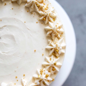 Apple Cider Layer Cake. Yellow cake flavored with apple cider. Layered cake is filled with cooked apples and frosted with apple cider buttercream.