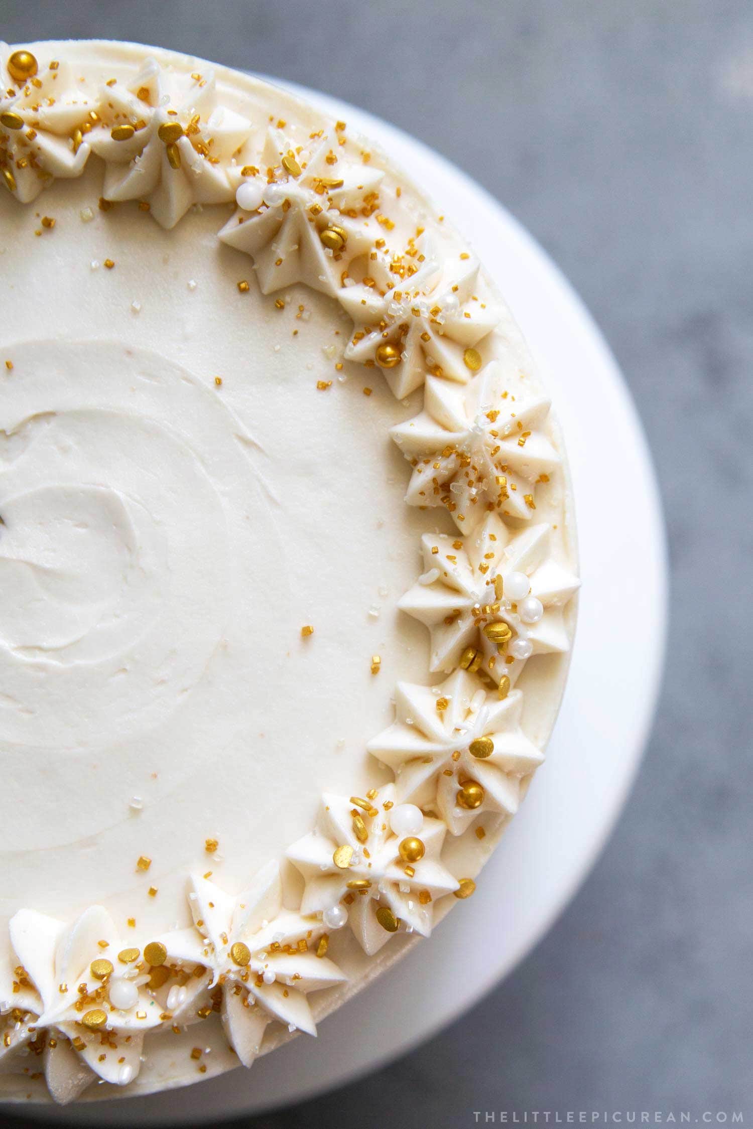 Apple Cider Layer Cake. Yellow cake flavored with apple cider. Layered cake is filled with cooked apples and frosted with apple cider buttercream.