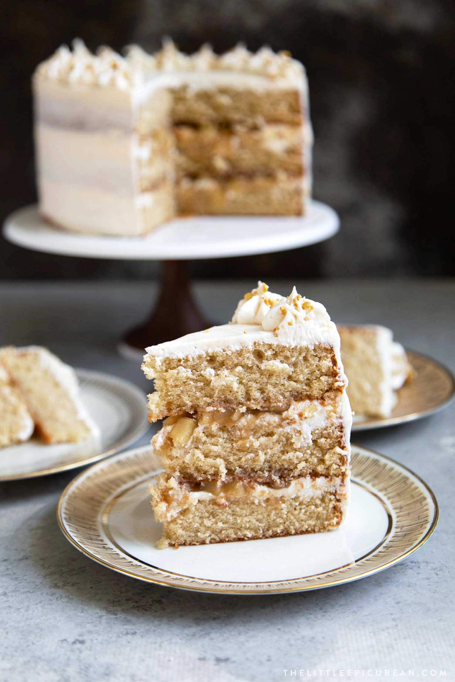 Apple Cider Layer Cake. Yellow cake flavored with apple cider. Layered cake is filled with cooked apples and frosted with apple cider buttercream.