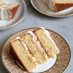 Apple Cider Layer Cake. Yellow cake flavored with apple cider. Layered cake is filled with cooked apples and frosted with apple cider buttercream.