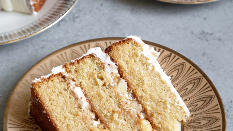 Apple Cider Layer Cake. Yellow cake flavored with apple cider. Layered cake is filled with cooked apples and frosted with apple cider buttercream.