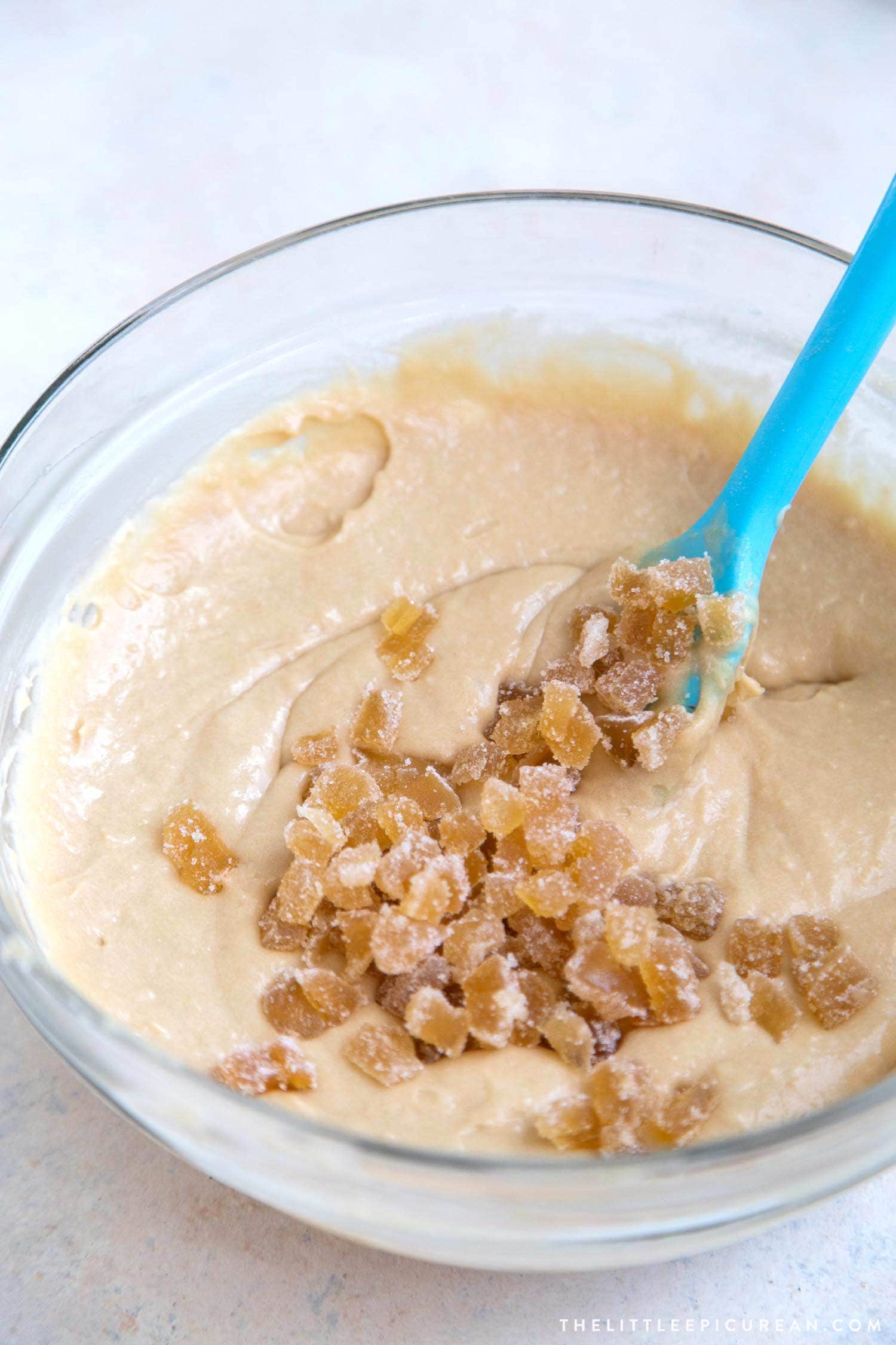 Ginger cake batter with candied ginger pieces