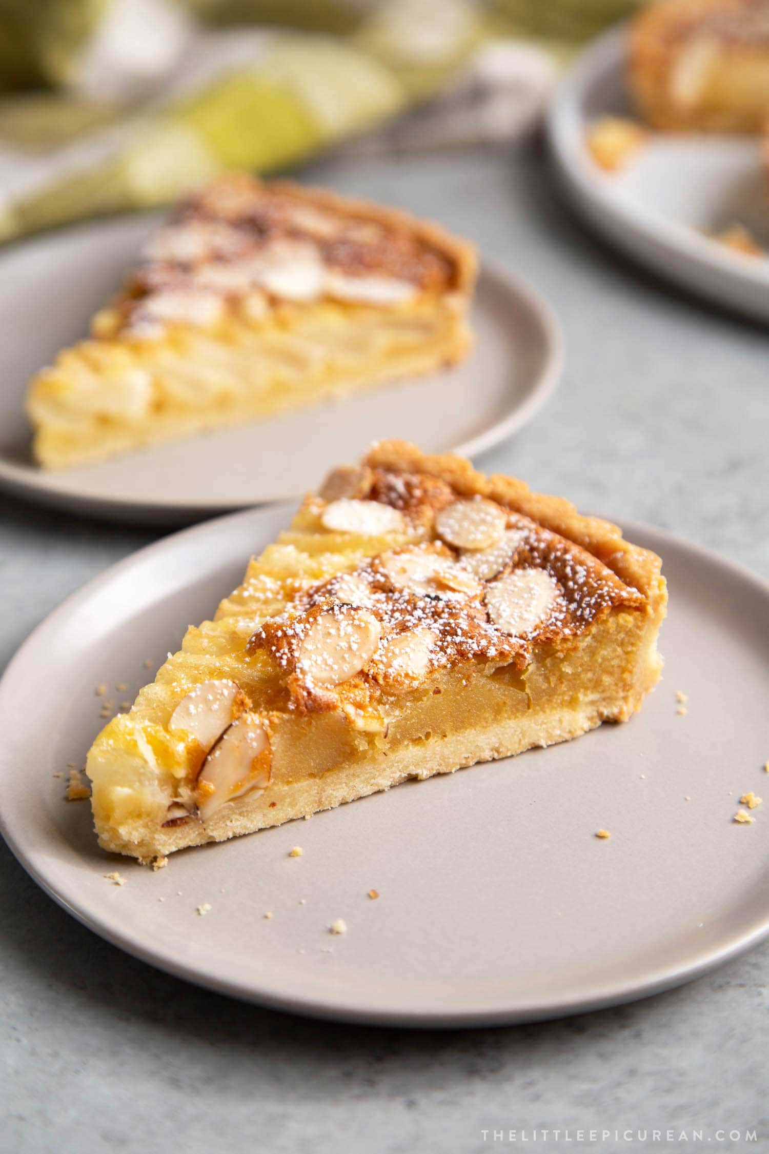Pear Frangipane Tart Slice. Buttery shortbread crust baked with almond frangipane filling and pears.