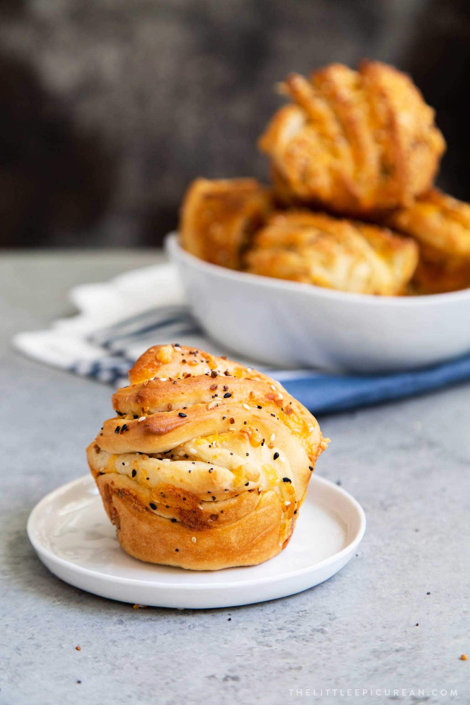 Cheddar Everything Babka Buns. Soft yeasted layered bread dough filled with shredded cheddar cheese and everything bagel seasoning mix.