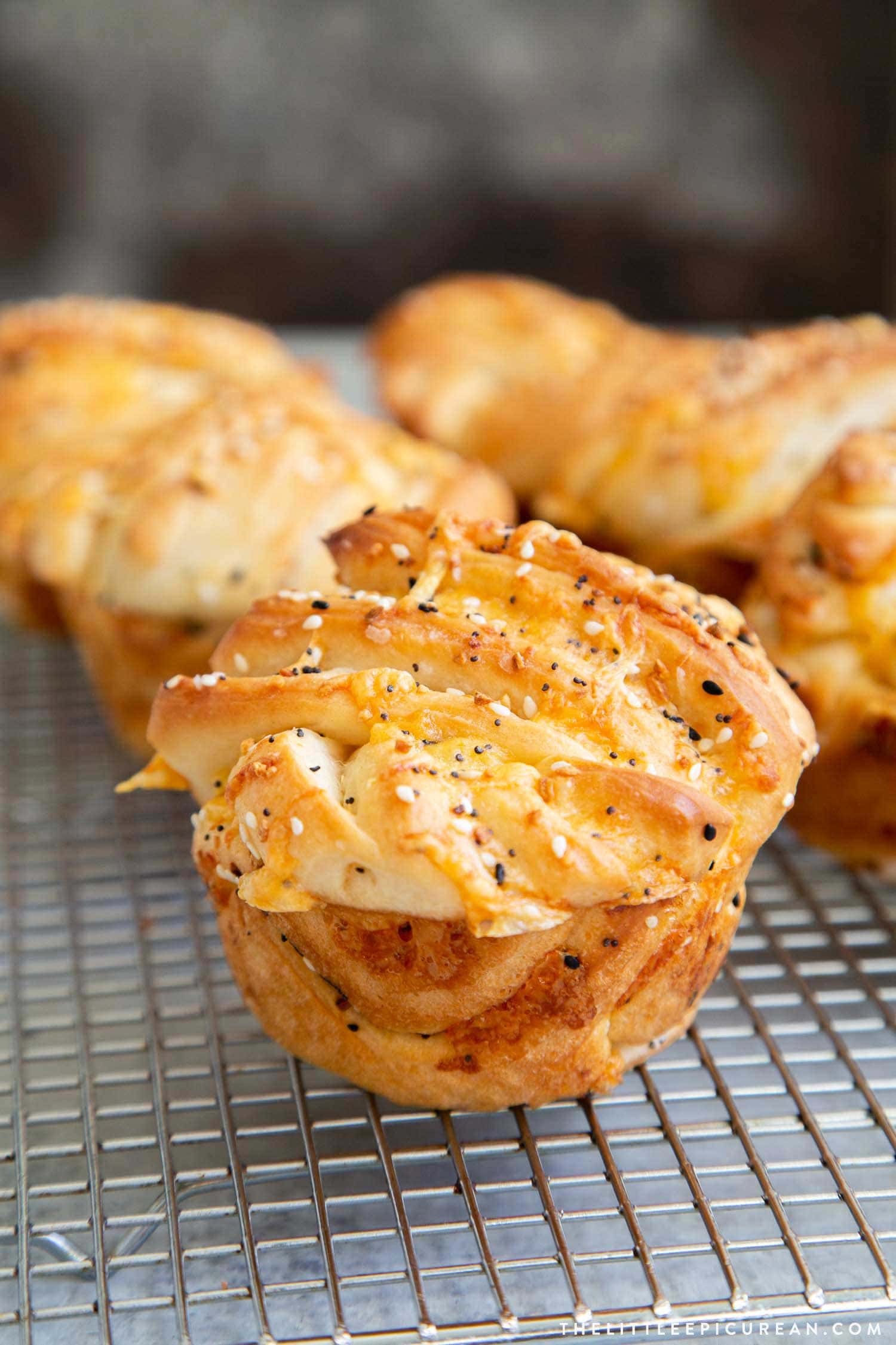 Cheddar Everything Babka Buns. Soft yeasted layered bread dough filled with shredded cheddar cheese and everything bagel seasoning mix.