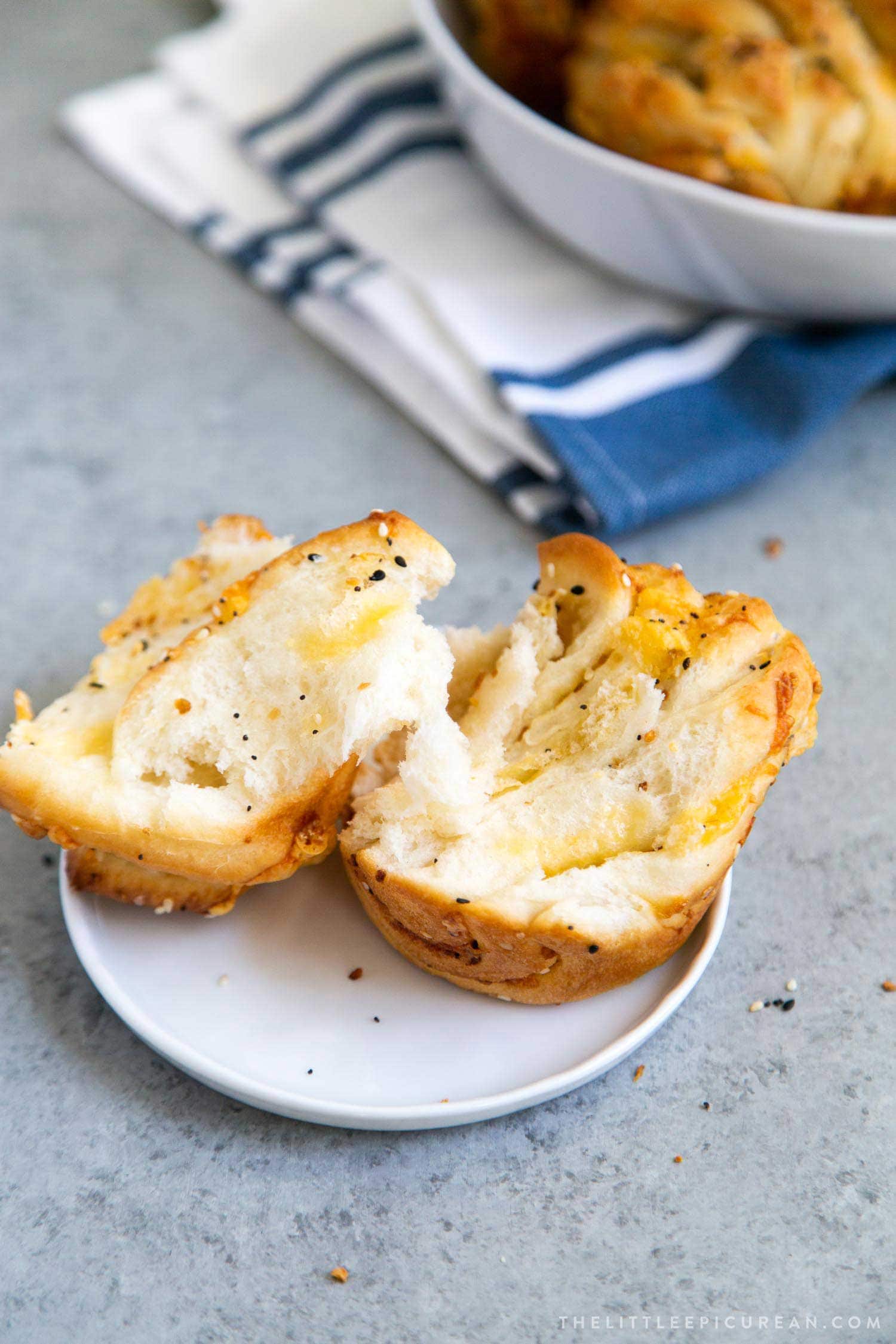 Cheddar Everything Babka Buns. Soft yeasted layered bread dough filled with shredded cheddar cheese and everything bagel seasoning mix.