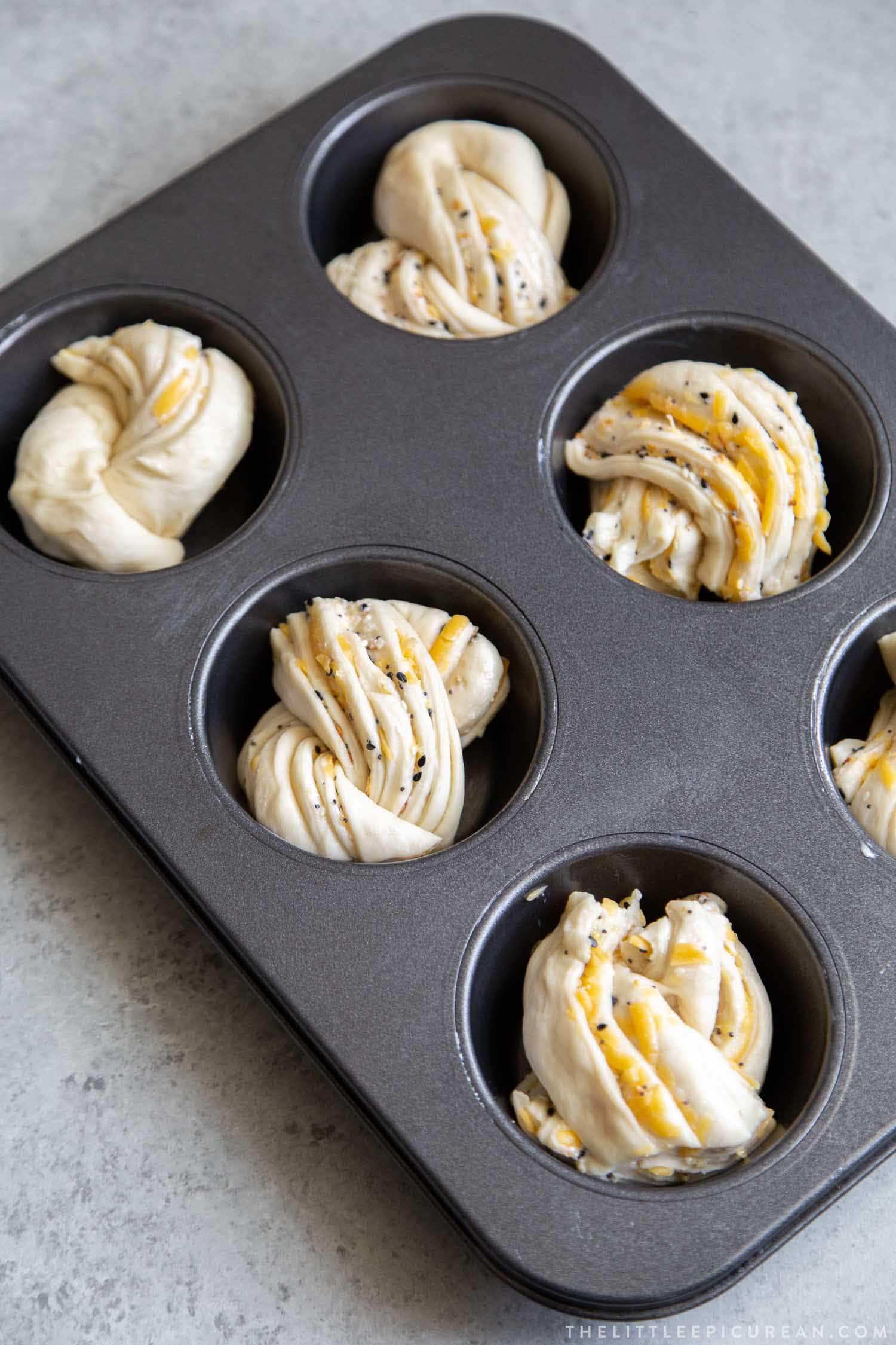 Cheddar Everything Babka Buns baked in giant muffin tins