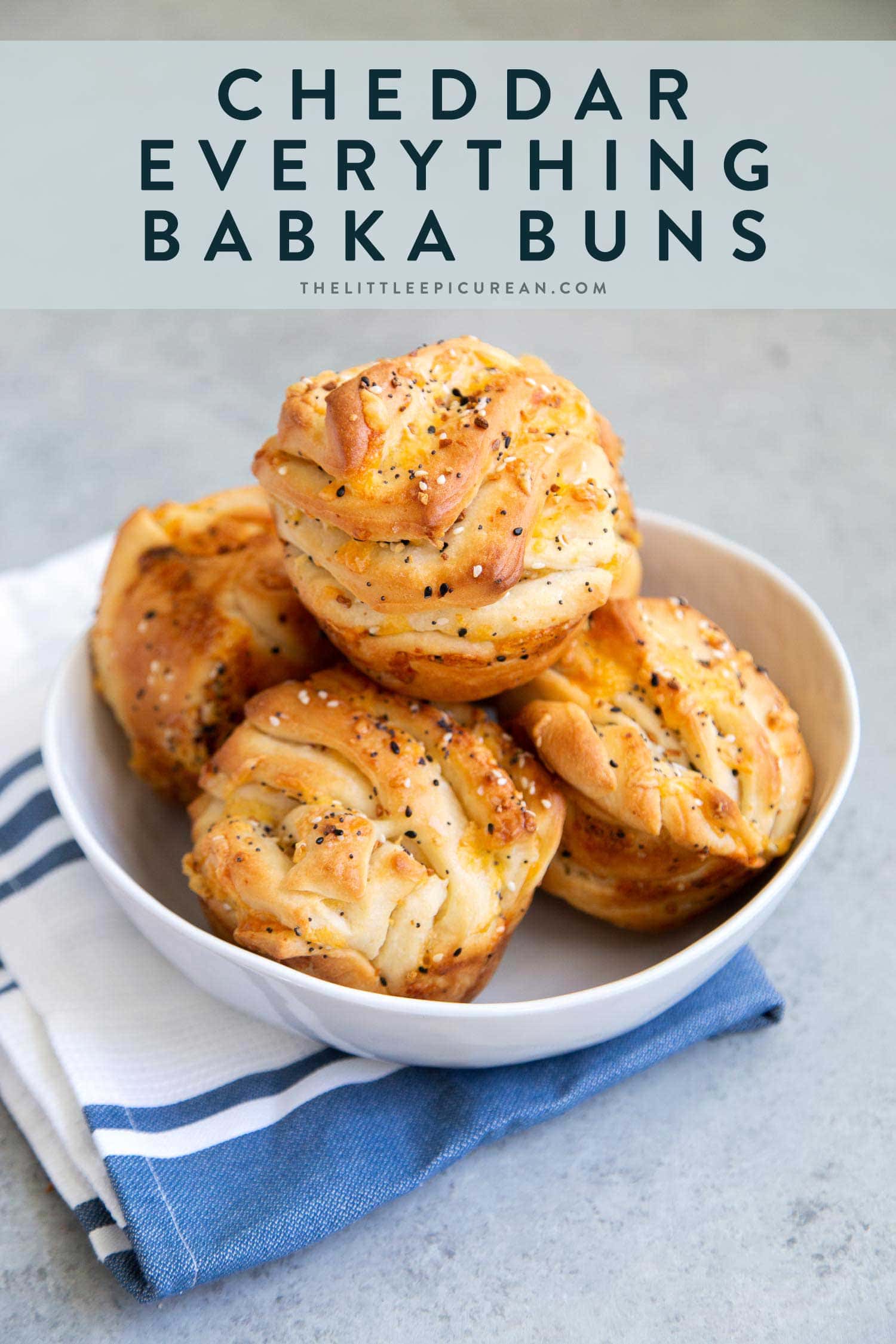 Cheddar Everything Babka Buns. Soft yeasted layered bread dough filled with shredded cheddar cheese and everything bagel seasoning mix.