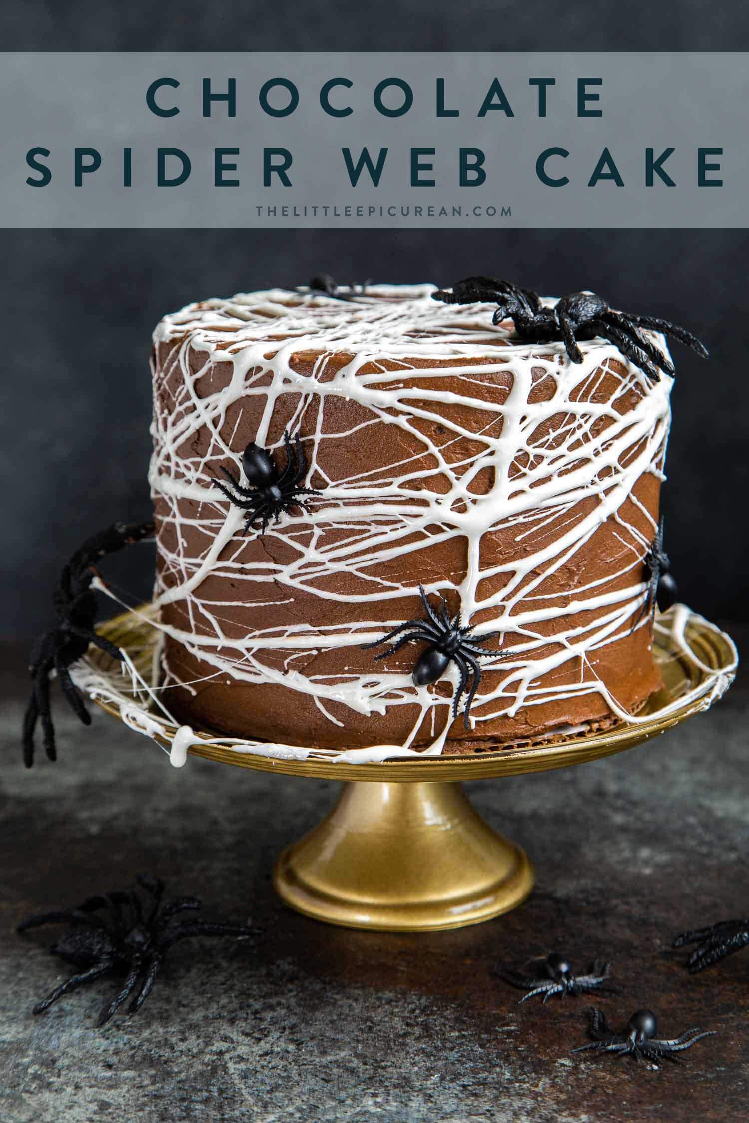 Chocolate Spider Web Cake. Three layer chocolate cake frosted with simple chocolate buttercream and decorated with marshmallow spider webs. It's the perfect Halloween treat!