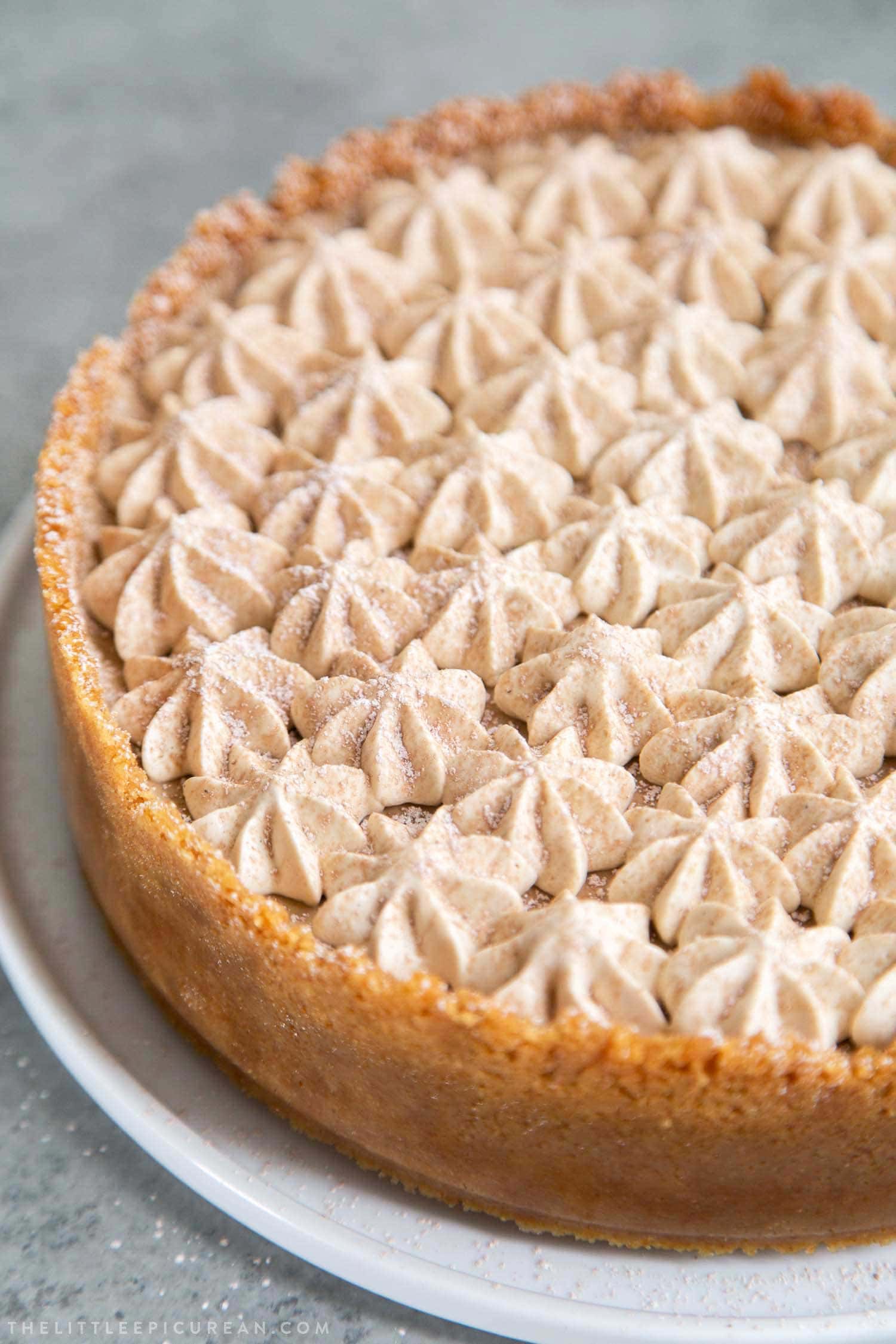 Coffee Mousse Cheesecake. Graham cracker crust, silky cheesecake layer topped with coffee mousse and whipped cream.