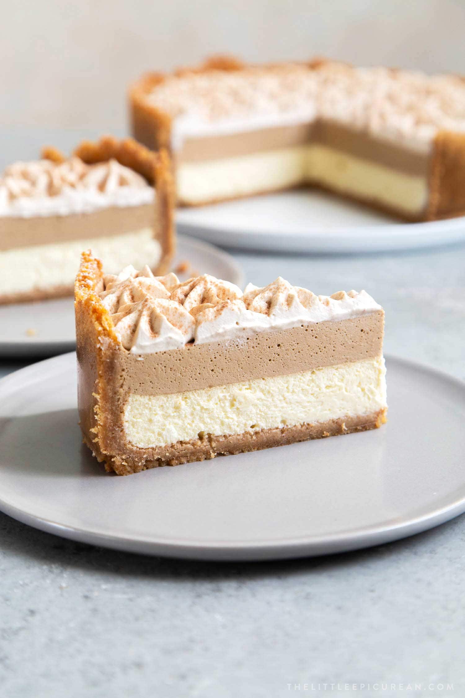 Coffee Mousse Cheesecake. Graham cracker crust, silky cheesecake layer topped with coffee mousse and whipped cream.