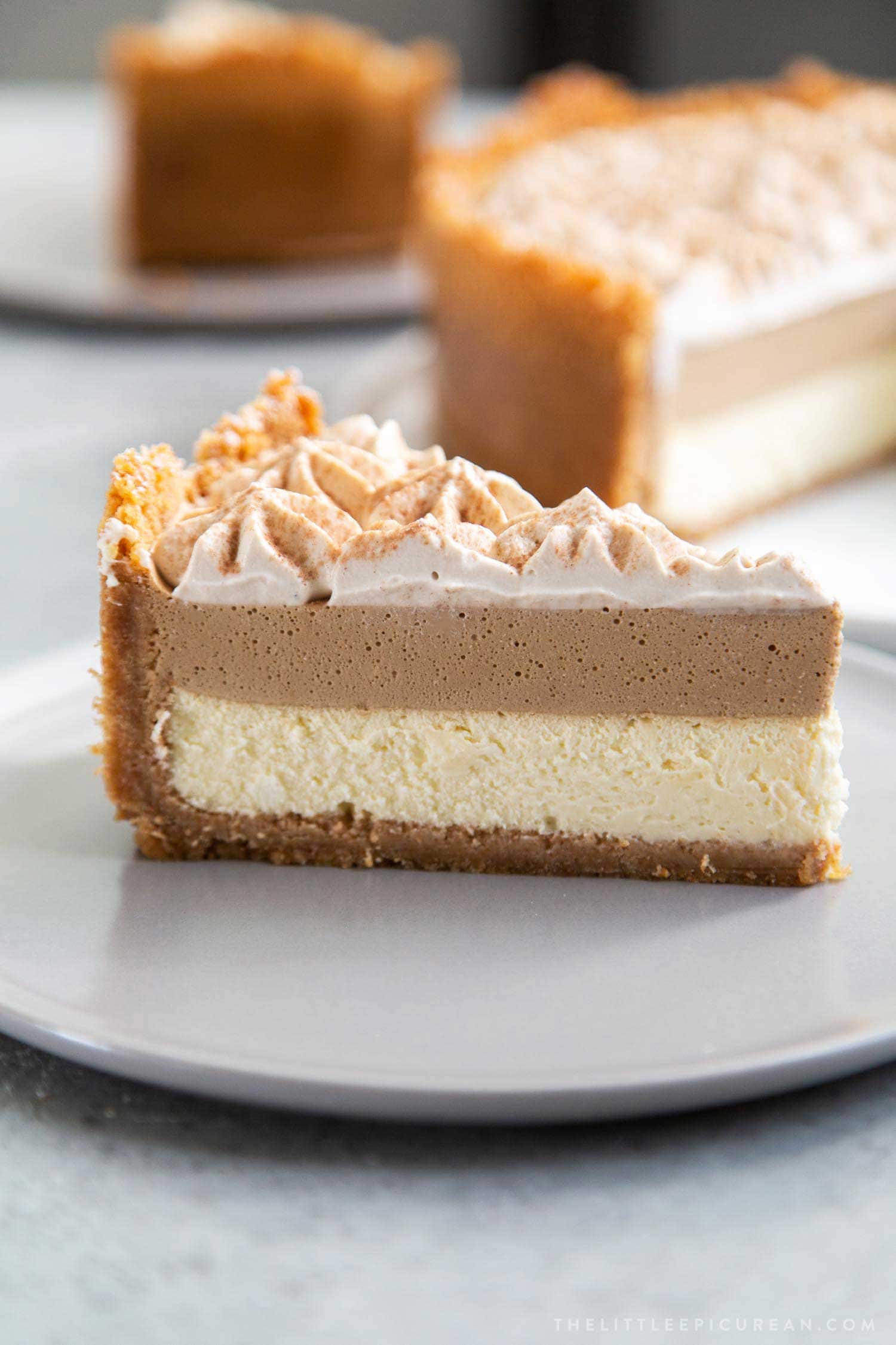 Coffee Mousse Cheesecake. Graham cracker crust, silky cheesecake layer topped with coffee mousse and whipped cream.