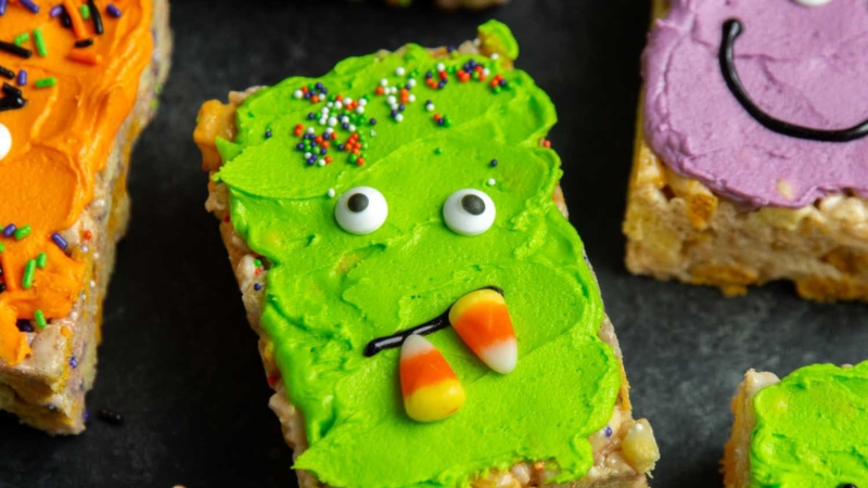 Monster Marshmallow Cereal Treats. Brown butter cereal treats frosted with buttercream and decorated with candies. It's a fun project to do with kids this Halloween!