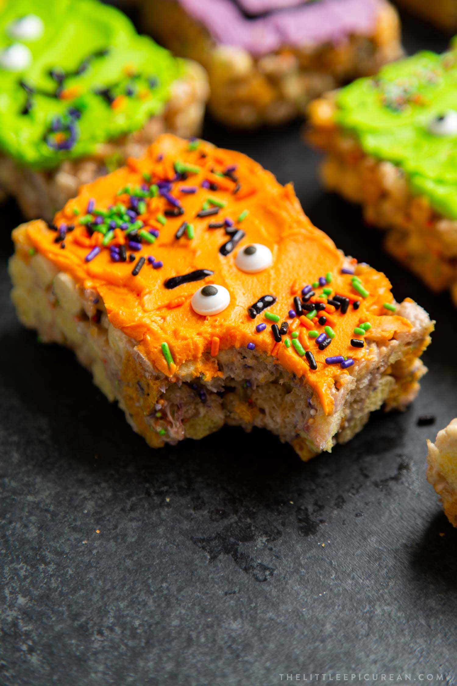 Monster Marshmallow Cereal Treats. Brown butter cereal treats frosted with buttercream and decorated with candies. It's a fun project to do with kids this Halloween!