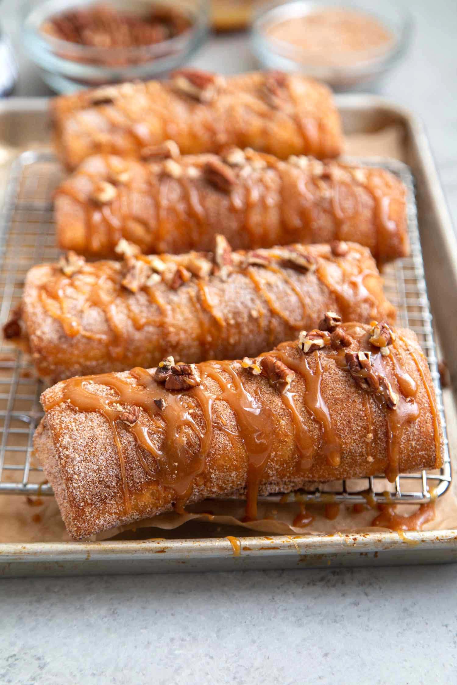 Pineapple Cheesecake Chimichangas. Crispy fried burritos filled with vanilla cream cheese and cinnamon spiced pineapple chunks. The dessert chimichangas are tossed in a sweet graham cracker powder.