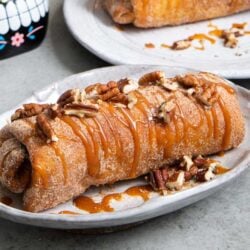 Pineapple Cheesecake Chimichangas. Crispy fried burritos filled with vanilla cream cheese and cinnamon spiced pineapple chunks. The dessert chimichangas are tossed in a sweet graham cracker powder.