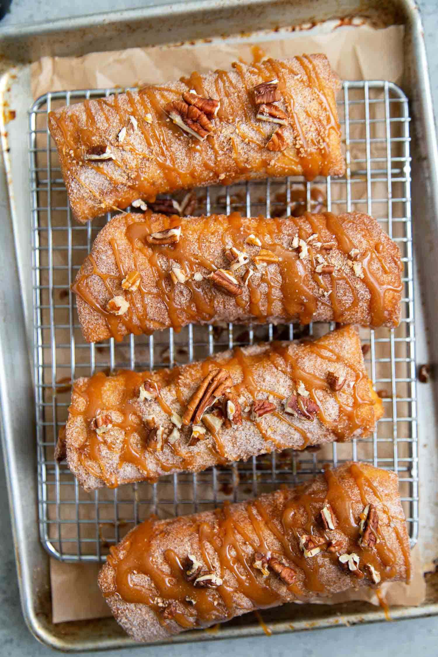 Pineapple Cheesecake Chimichangas. Crispy fried burritos filled with vanilla cream cheese and cinnamon spiced pineapple chunks. The dessert chimichangas are tossed in a sweet graham cracker powder.