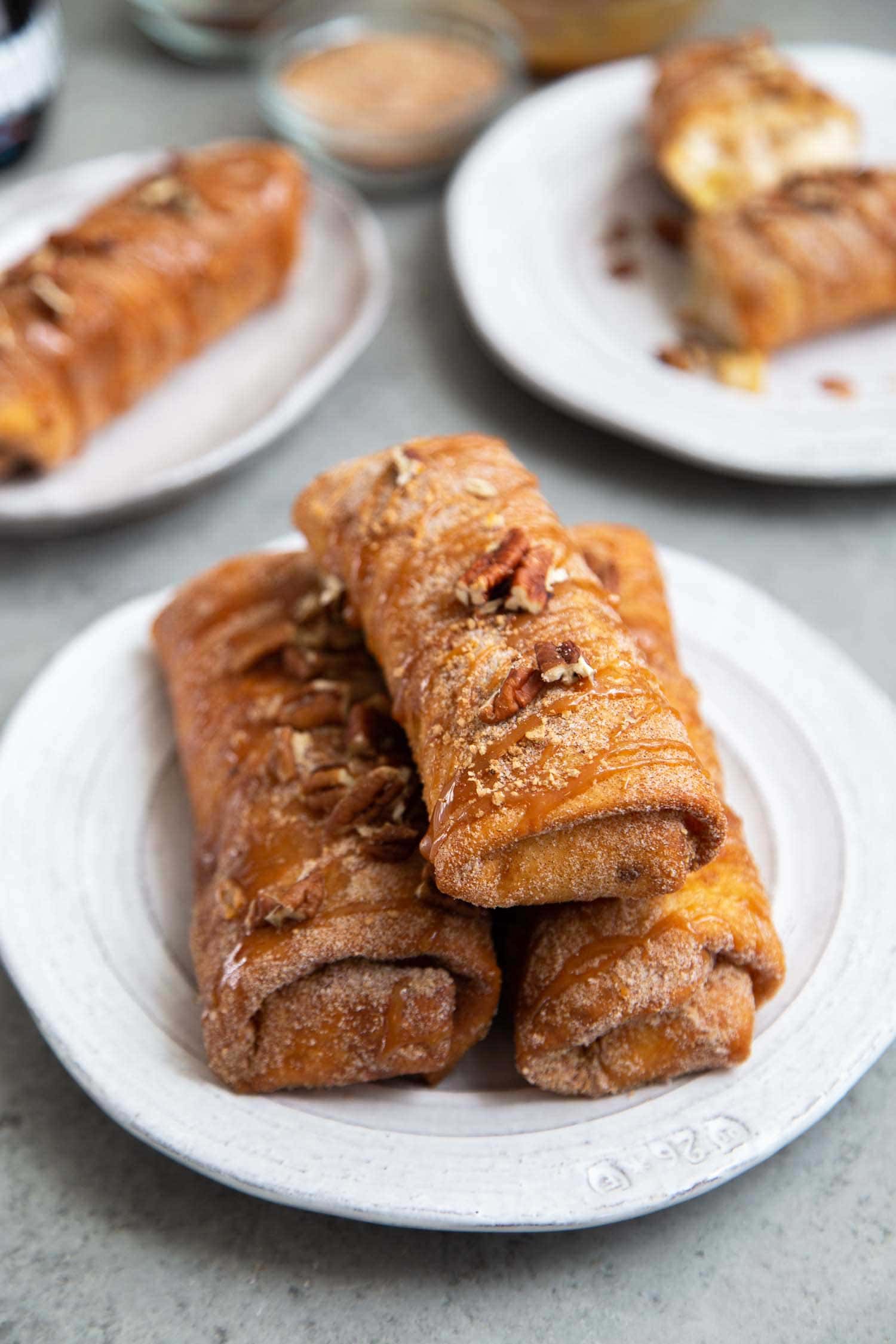 Pineapple Cheesecake Chimichangas. Crispy fried burritos filled with vanilla cream cheese and cinnamon spiced pineapple chunks. The dessert chimichangas are tossed in a sweet graham cracker powder.