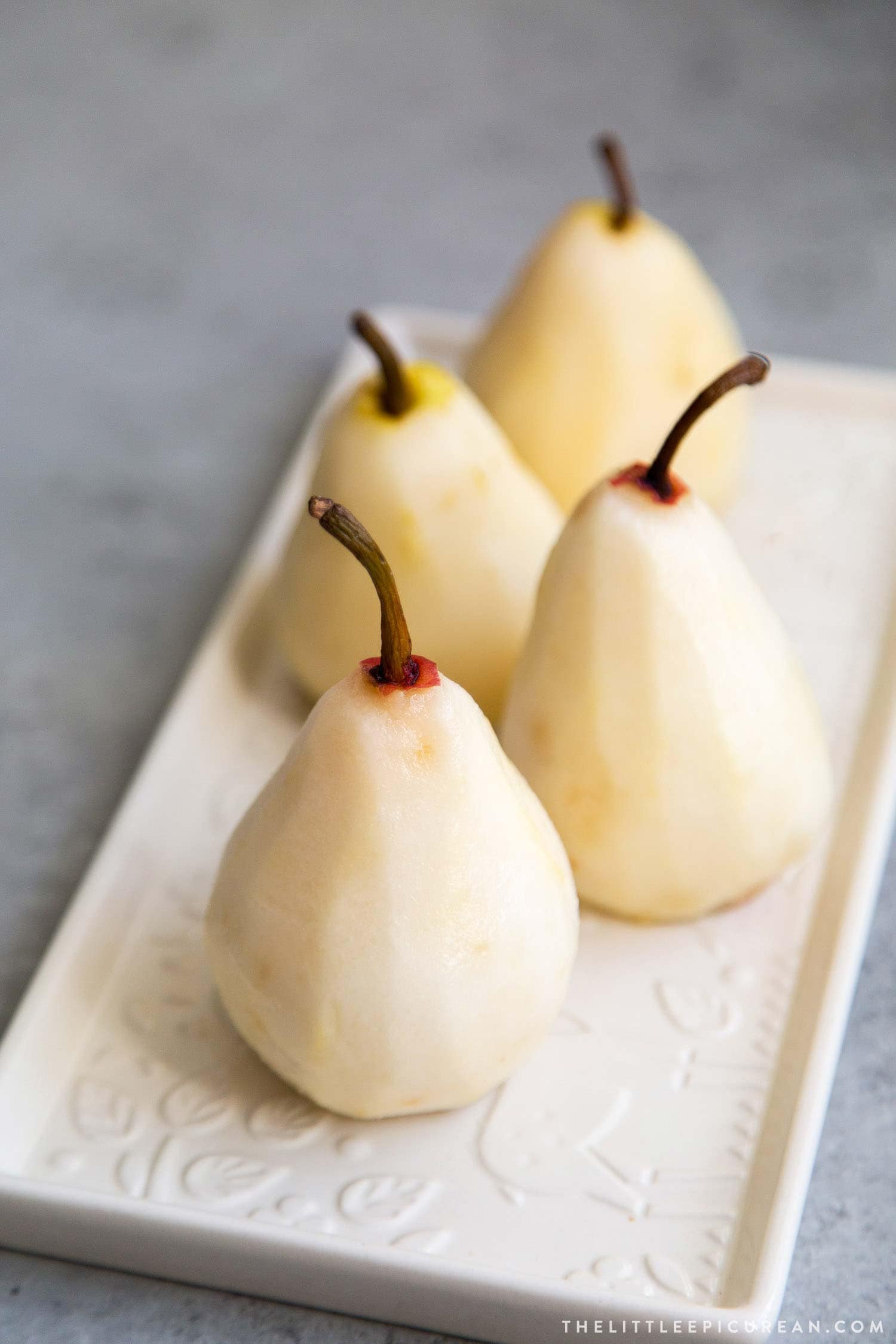 How to Poach Pears. These pears are poached in a sweet vanilla cinnamon liquid until fragrant and flavorful. They are chilled overnight before serving. 