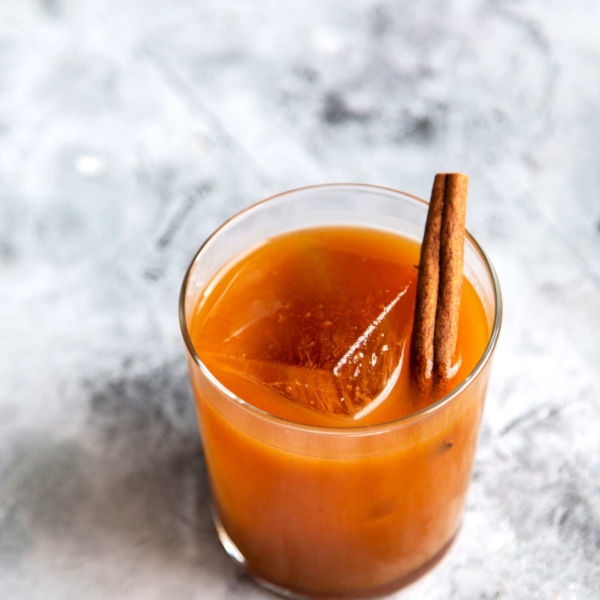 Garnish Pumpkin Bourbon Cocktail (autumn harvest cocktail) with a cinnamon stick.